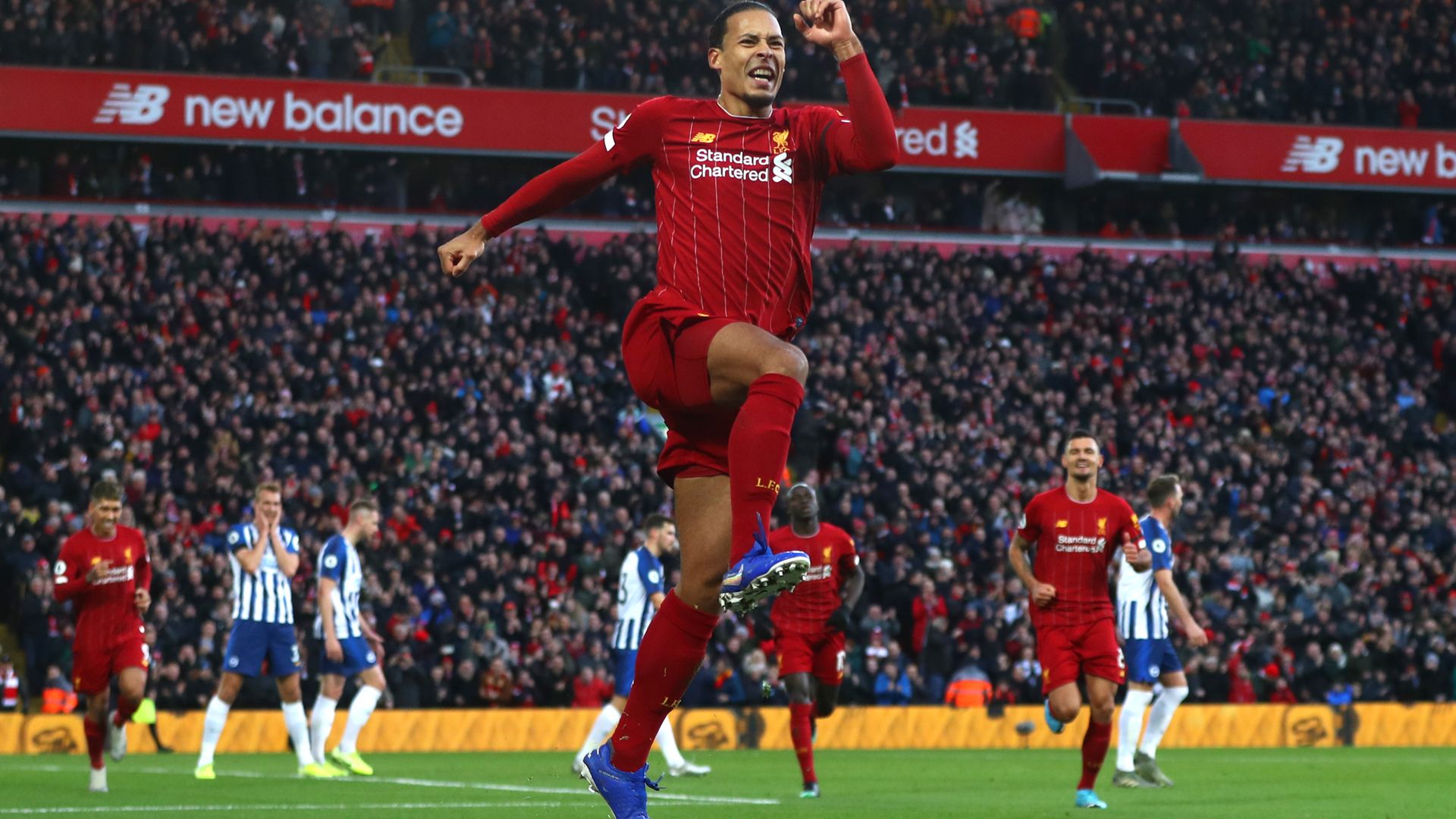 Liverpool's Virgil Van Dijk celebrating a goal against Brighton and Hove Albion. Would he have been able to play in England under rules about to be introduced? - Credit: Getty Images