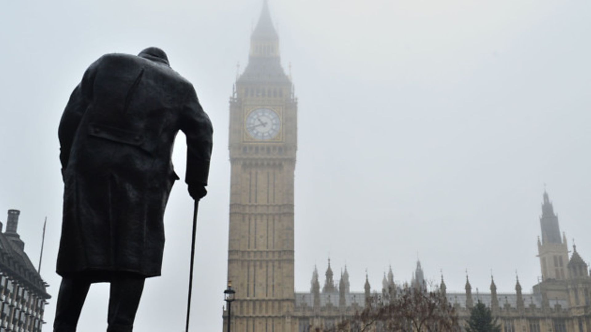 The statue of Winston Churchill in Parliament Square and the Houses of Parliament - Credit: PA Wire/PA Images
