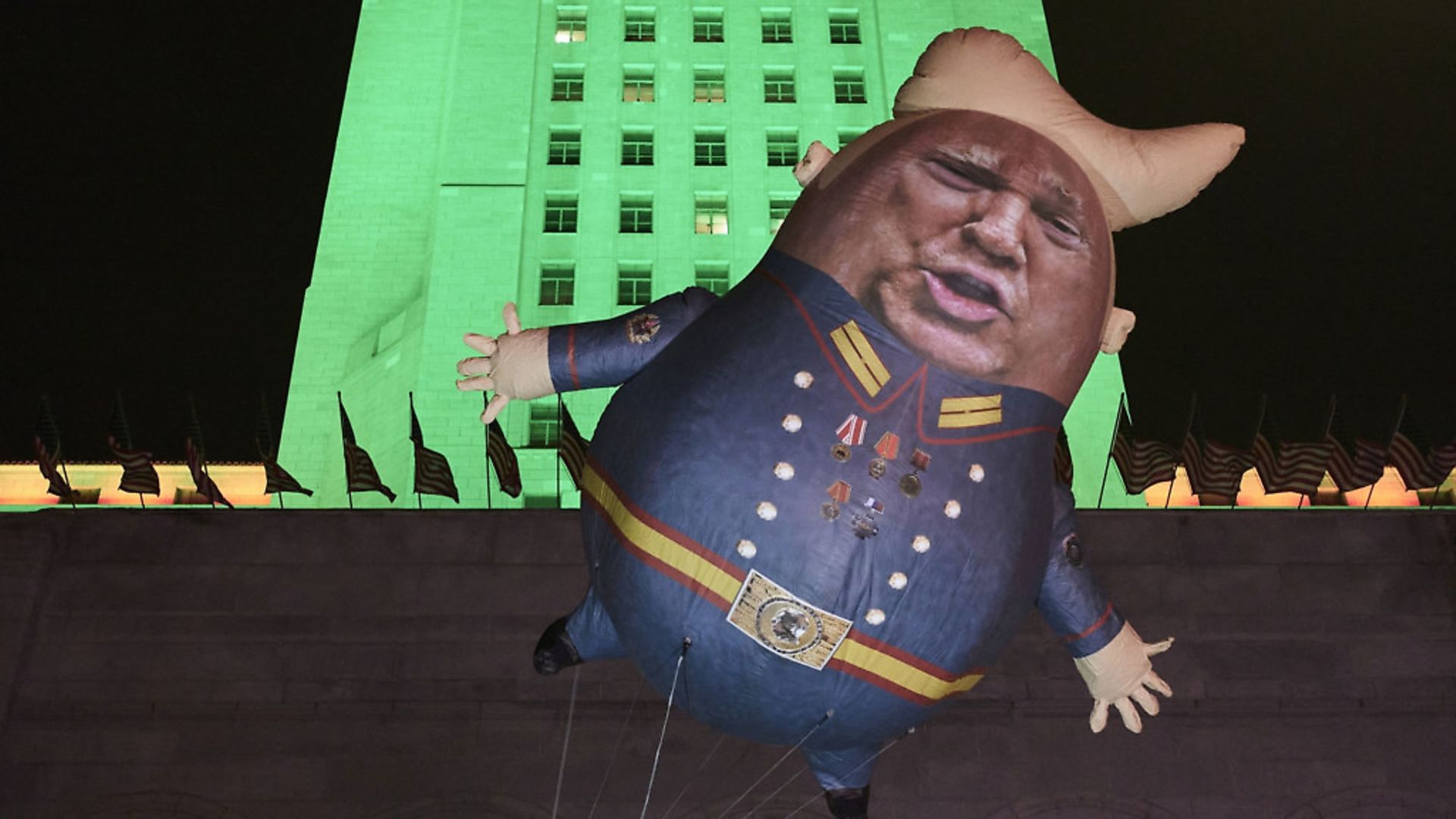 A Baby Trump Balloon floats outside City Hall in Los Angeles. (AP Photo/Damian Dovarganes) - Credit: AP