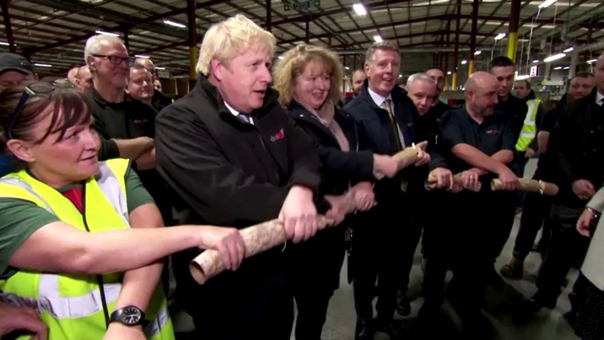 Boris Johnson pulls a Christmas cracker. Photograph: YouTube. - Credit: Archant