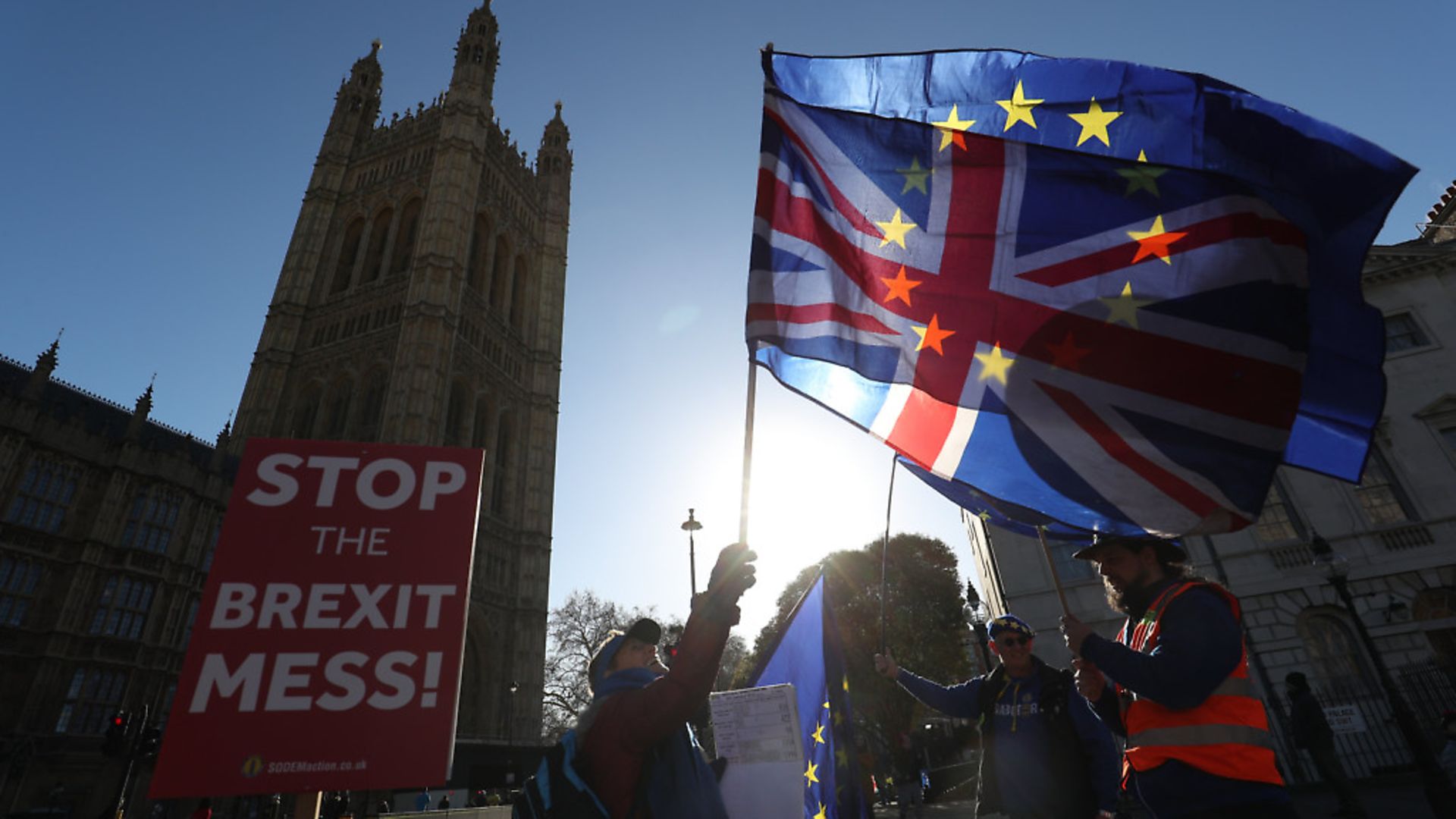 Anti-Brexit campaigners wave Union and European Union flags outside the Houses of Parliament. Photograph: Jonathan Brady/PA. - Credit: PA Archive/PA Images