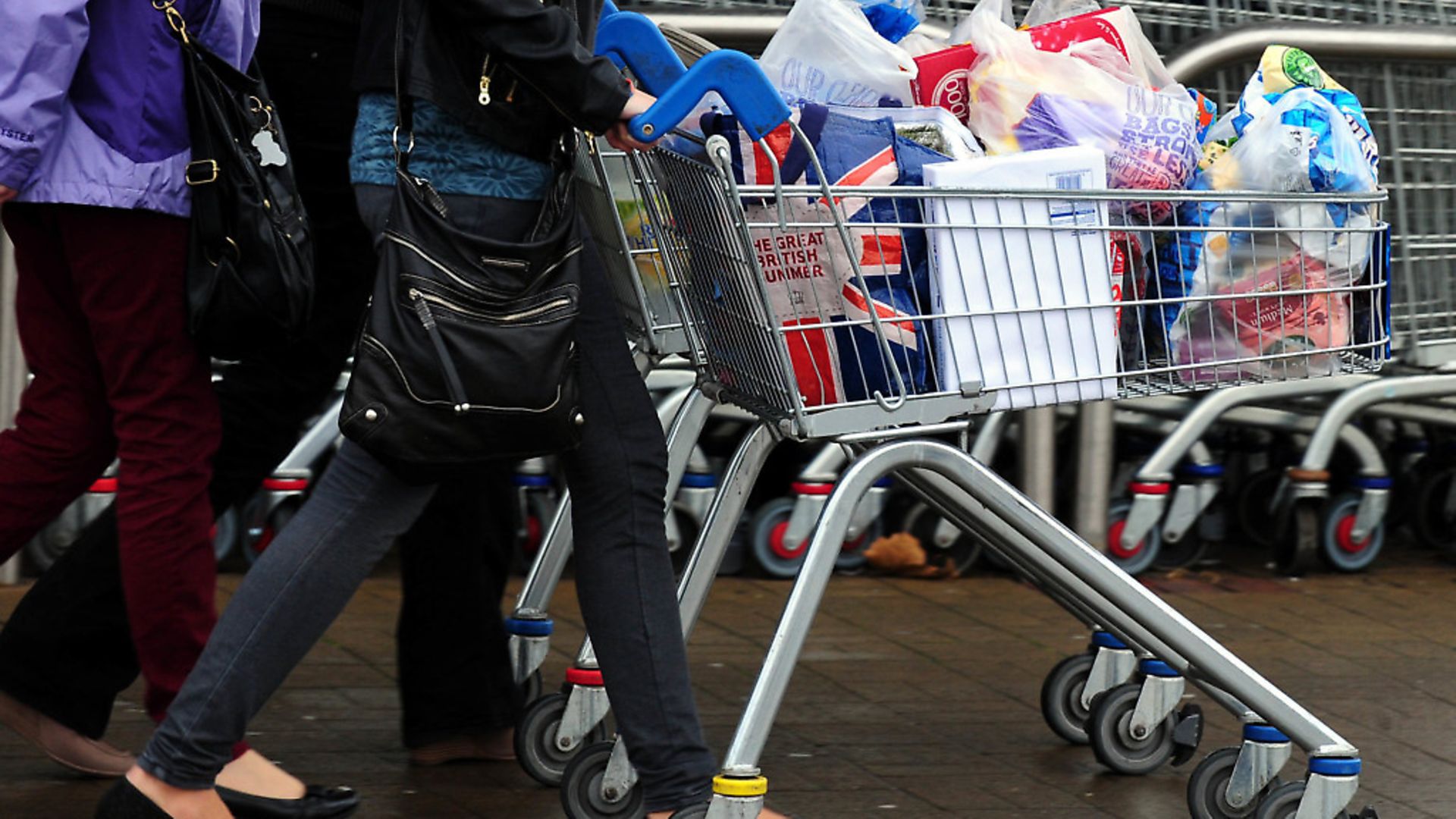 Customers leave a supermarket after food shopping. (Rui Vieira/PA) - Credit: PA Archive/PA Images