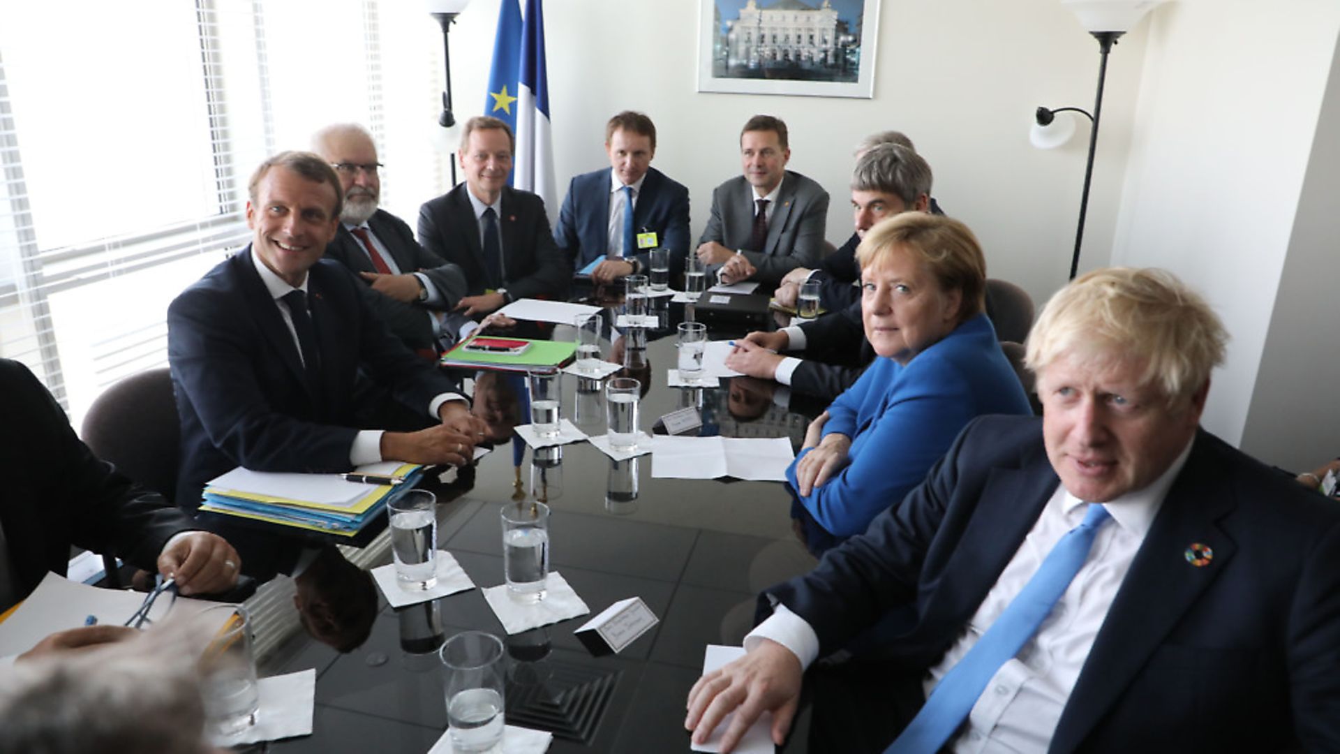 French President Emmanuel Macron (L) meets with German chancellor Angela Merkel (2-R) and British prime minister Boris Johnson (R) at the United Nations headquarters. (Photo by Ludovic MARIN / AFP). - Credit: AFP via Getty Images