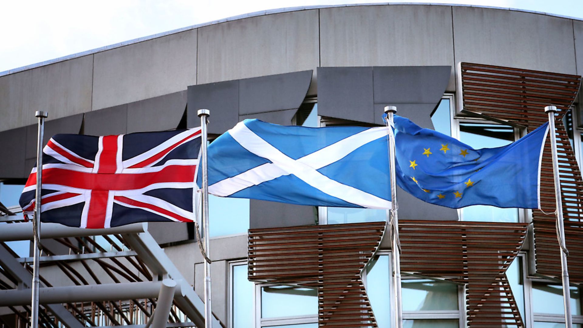The Union flag, Saltire and the European Union flag fly alongside each other outside the Scottish Parliament in Edinburgh. Photograph: Jane Barlow/PA Wire. - Credit: PA