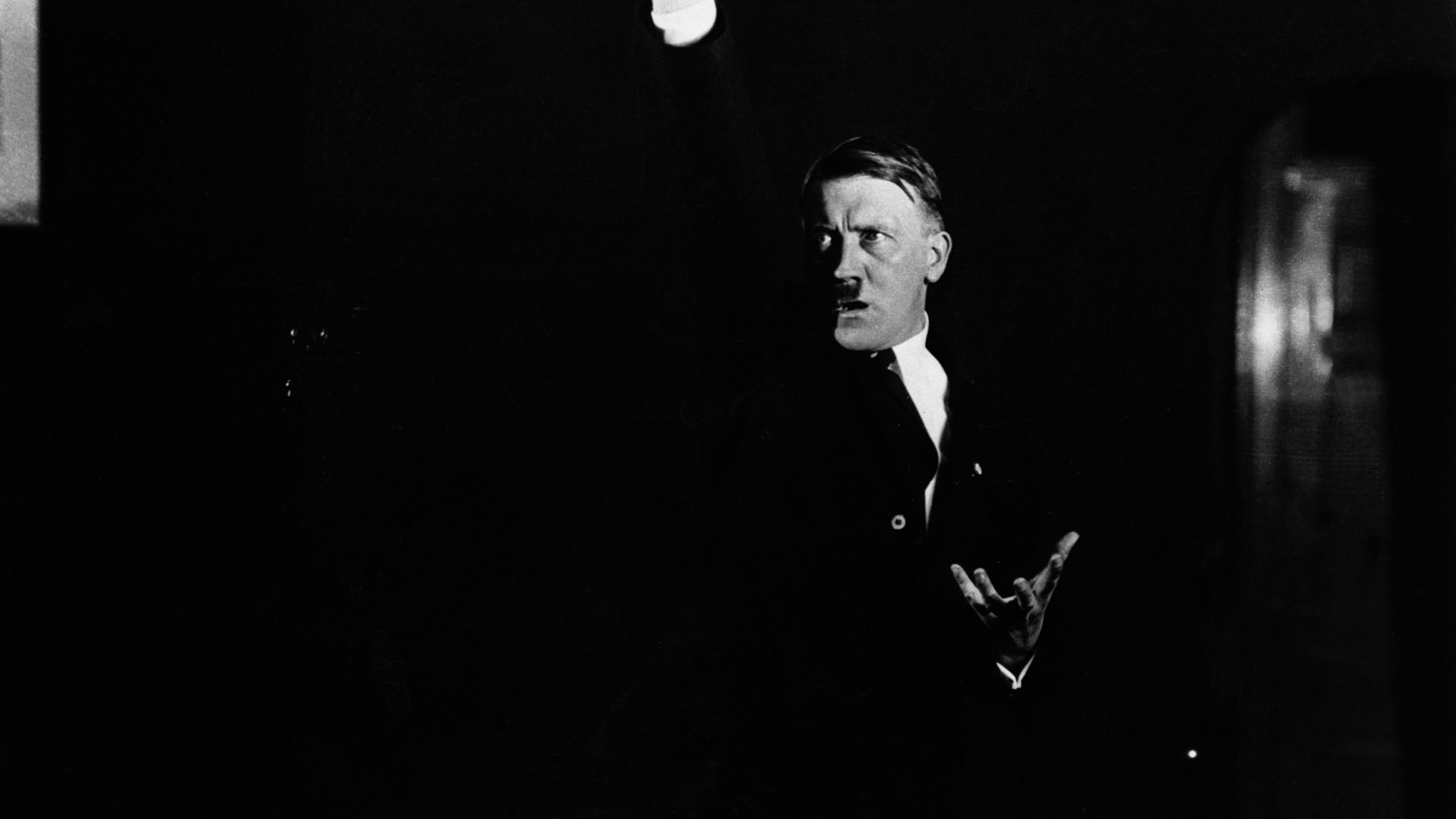 Hitler practices his speech making in front of a photographer so he can study the dramatic impact - Credit: Corbis via Getty Images