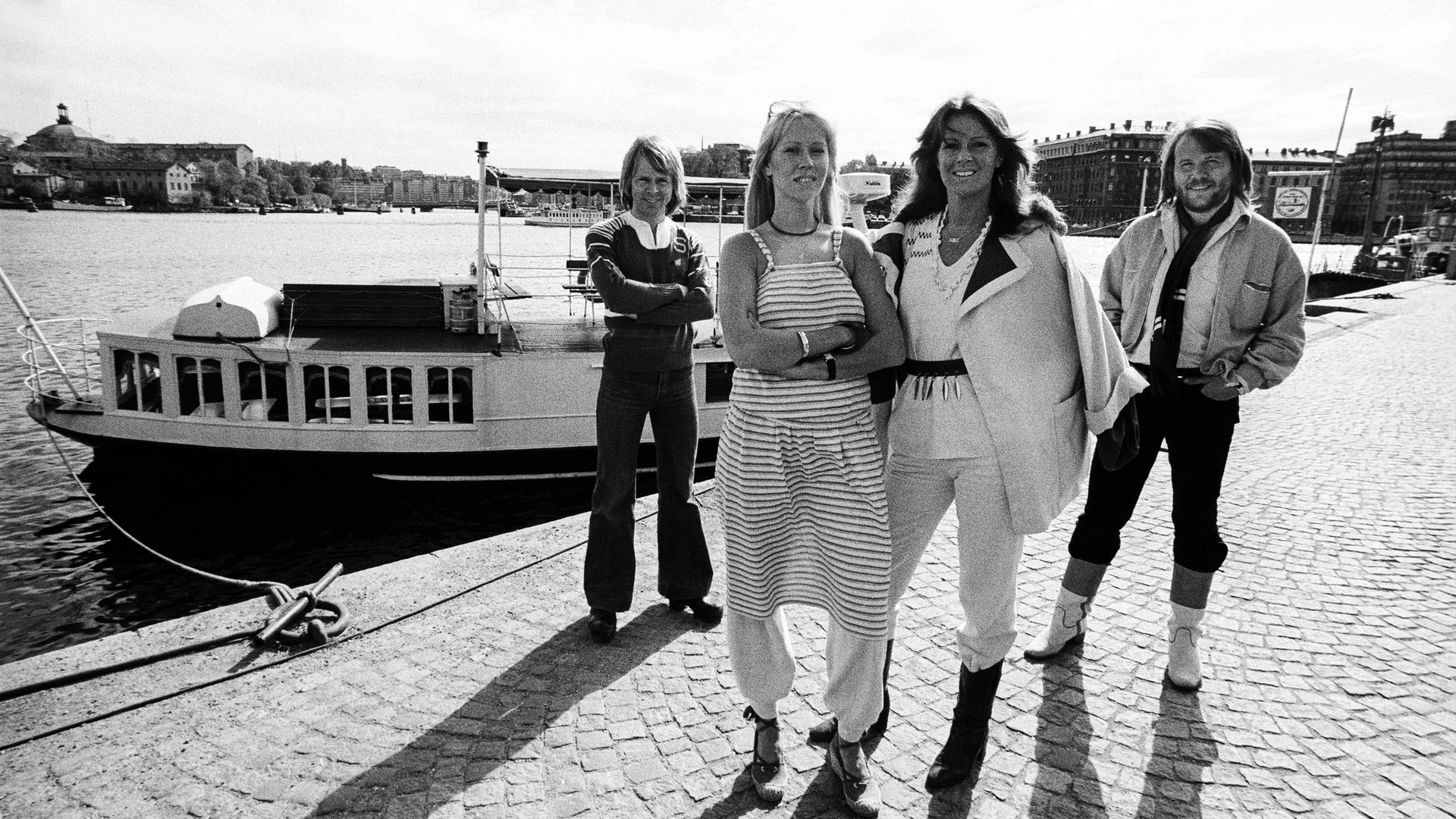 ABBA pose dockside in Stockholm's Gamla Stan (Old Town) in July 1977. Pictured from left: Bjorn Ulvaeus, Agnetha Faltskog, Anni-Frid Lyngstad, and Benny Andersson - Credit: Getty Images