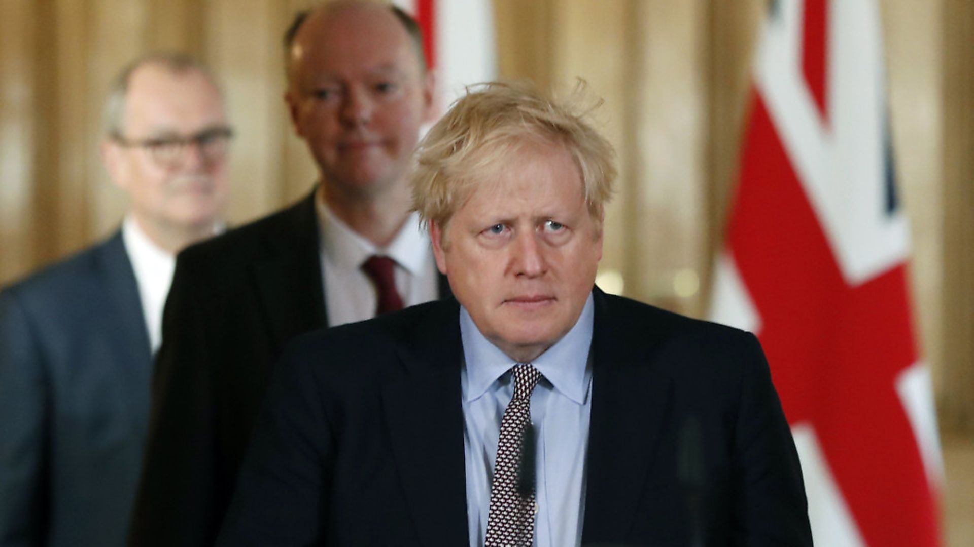 Prime Minister Boris Johnson arrives for a press conference with Chief Medical Officer for England Chris Whitty, (centre), and Chief Scientific Adviser Sir Patrick Vallance, to brief the media on the government's coronavirus action plan, at Downing Street. Photograph: Frank Augstein/PA. - Credit: PA