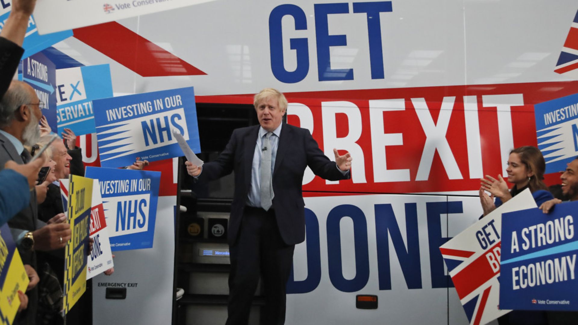 Prime Minister Boris Johnson addresses his supporters prior to boarding his general election campaign bus in Manchester - Credit: Getty Images