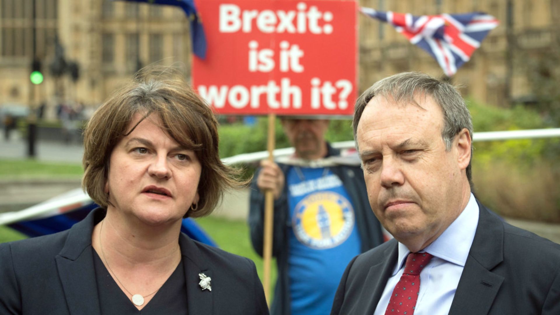 DUP leader Arlene Foster and deputy leader Nigel Dodds pictured with anti-Brexit campaigner Steve Bray - Credit: PA Wire/PA Images