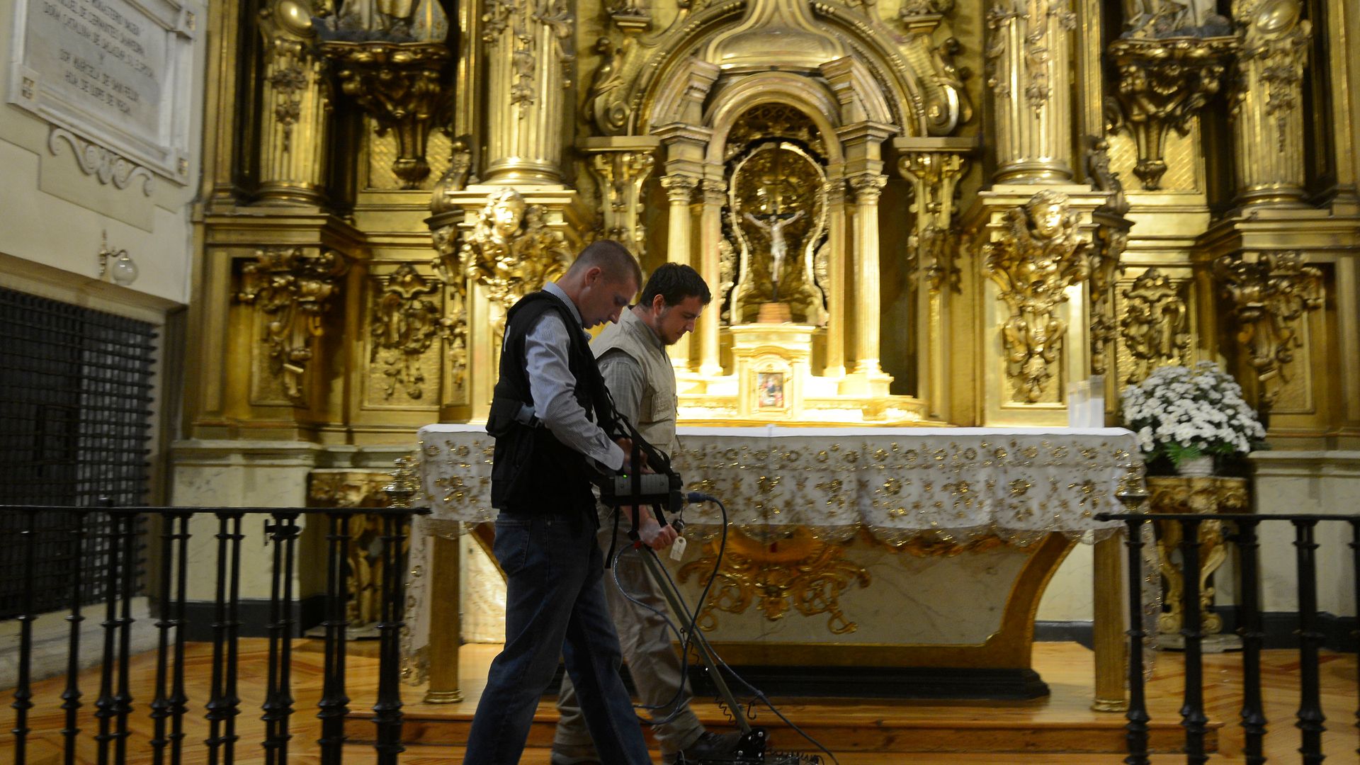 Two operators search for the remains of Miguel de Cervantes at the Convent of the Barefoot Trinitarians in Madrid in 2014. The same team are involved in the latest search - Credit: Getty Images