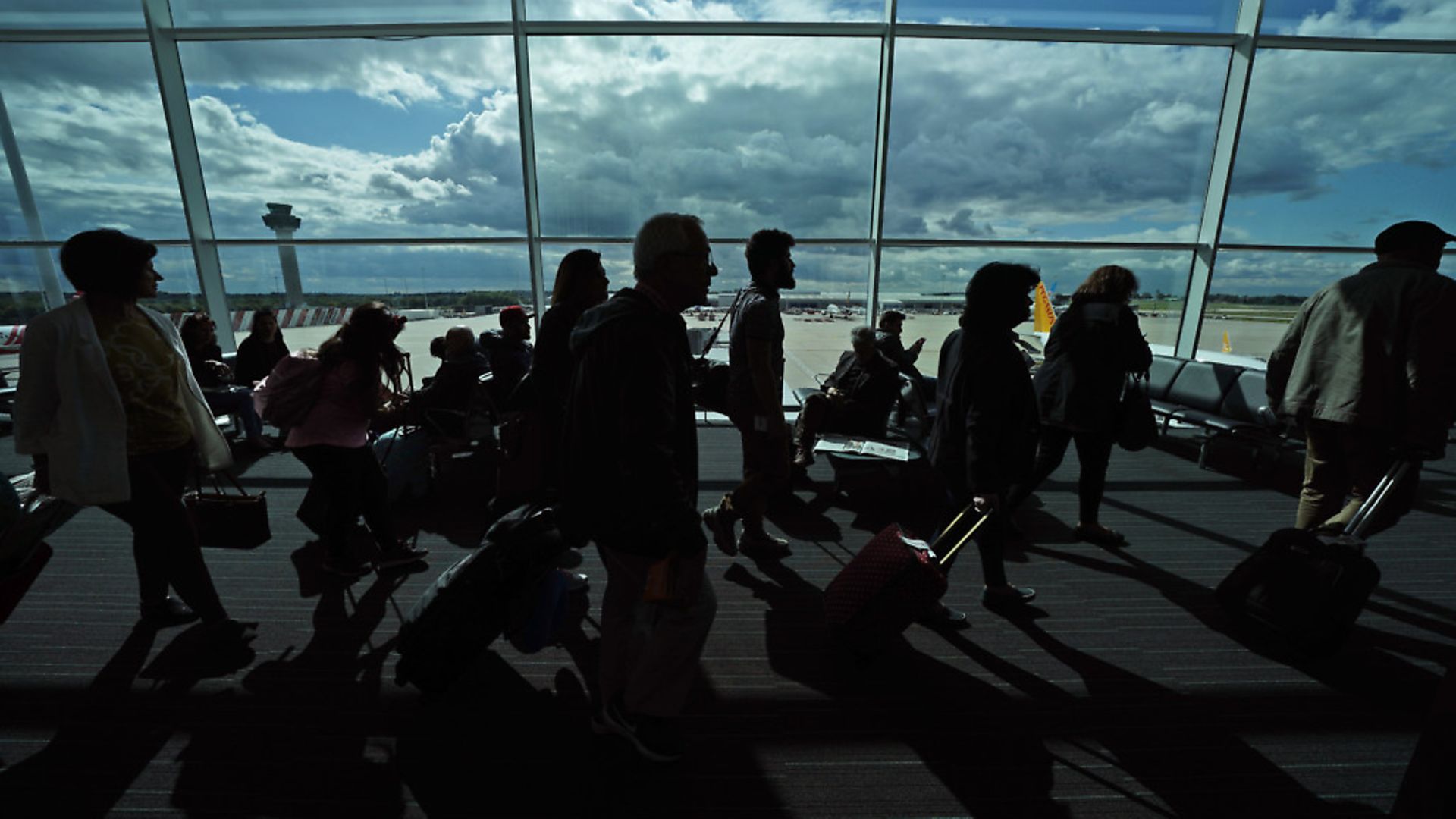 Passengers waiting in a departure lounge at London Stansted Airport. Photograph: Yui Mok/PA. - Credit: PA Archive/PA Images