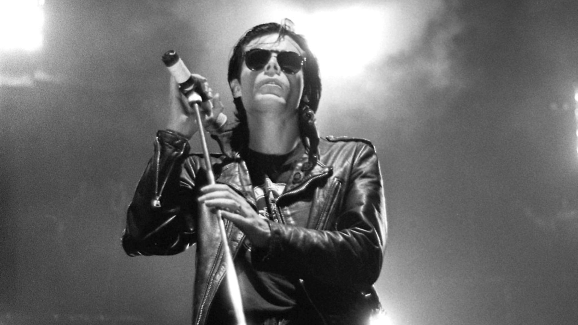 Sisters of Mercy frontman Andrew Eldritch performs on stage at Wembley Arena, London, in 1990. Picture: Getty Images - Credit: Getty Images