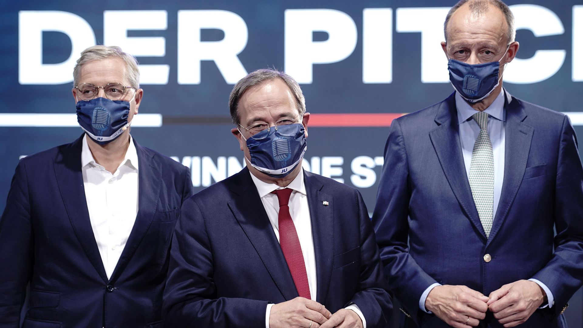 The three candidates for the leadership of the Christian Democratic Union party (CDU), Armin Laschet (C), Friedrich Merz (R) and Norbert Rottgen pose for a photo - Credit: POOL/AFP via Getty Images