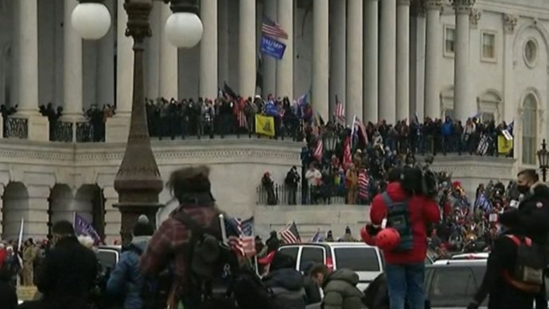 Trump protesters storming Capitol Hill - Credit: BBC