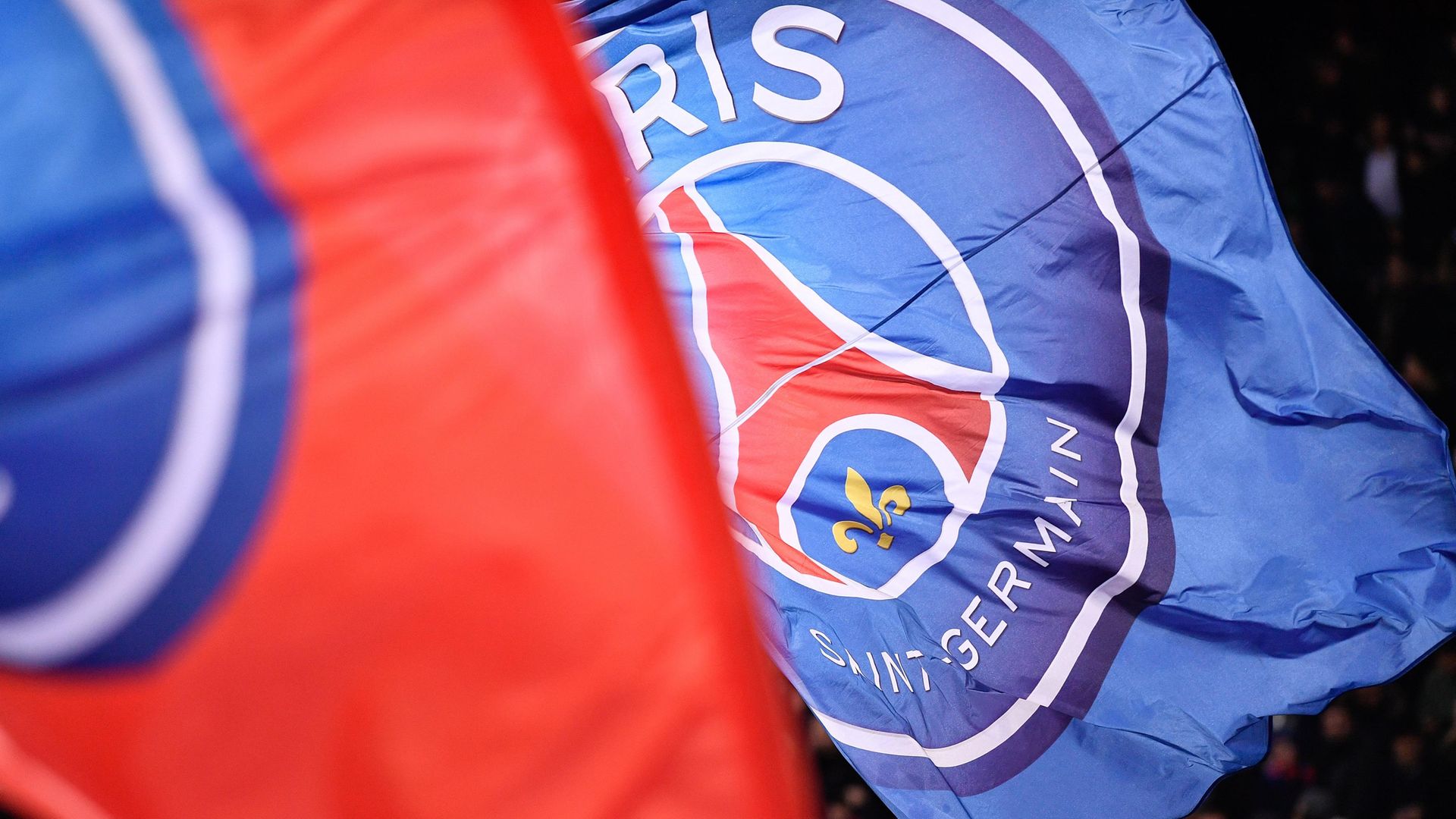 The Paris Saint-Germain flags wave at the Parc des Princes stadium (question three) - Credit: Julien Mattia/NurPhoto via Getty Images