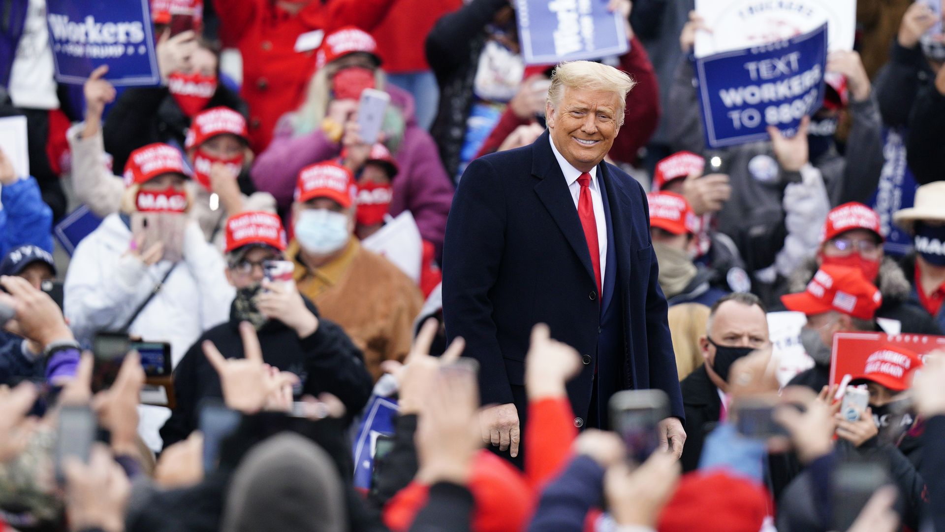 President Donald Trump arrives to speak at a campaign rally - Credit: PA