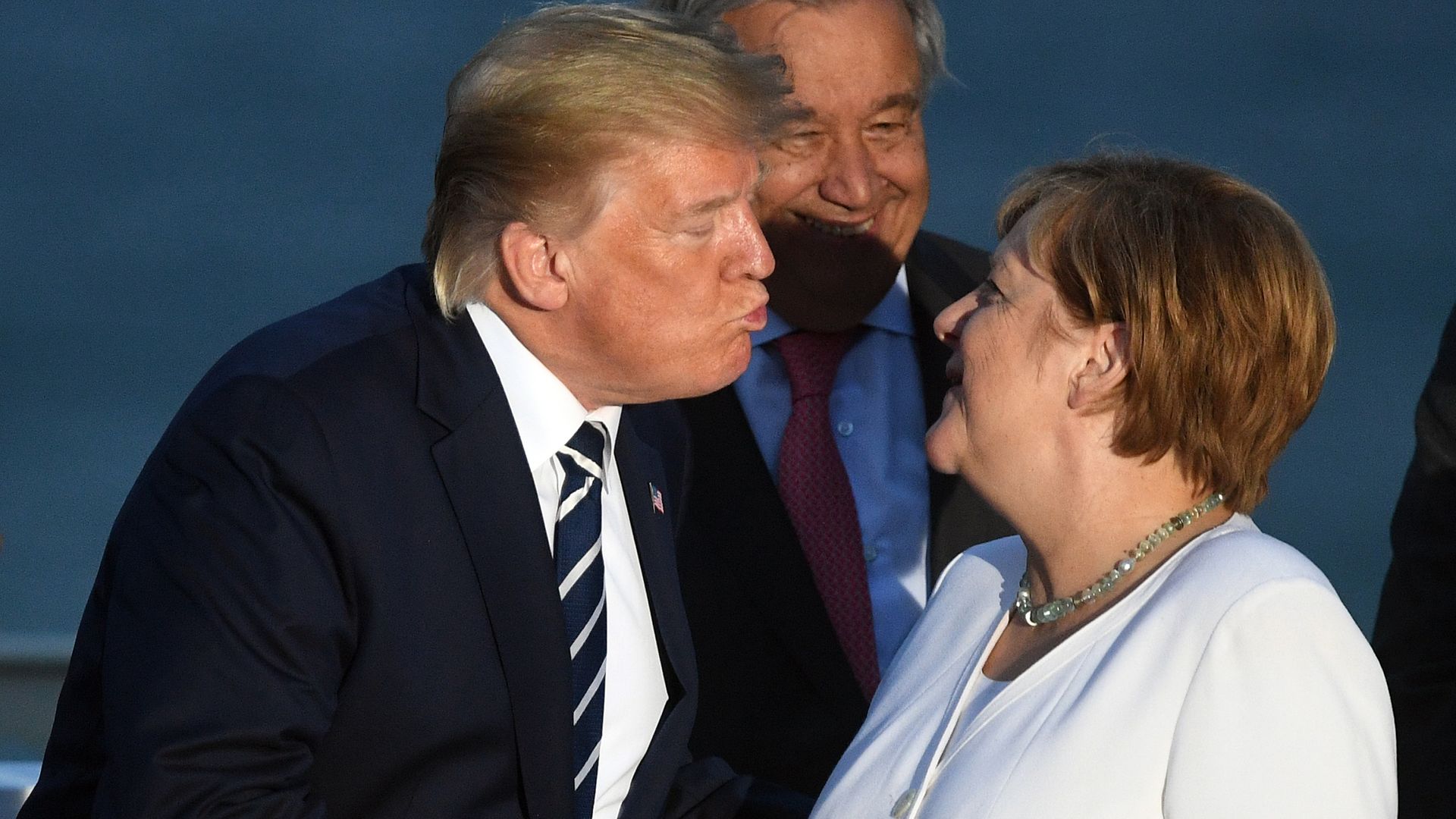US President Donald Trump and German Chancellor Angela Merkel at the G7 Summit in Biarritz, France - Credit: PA