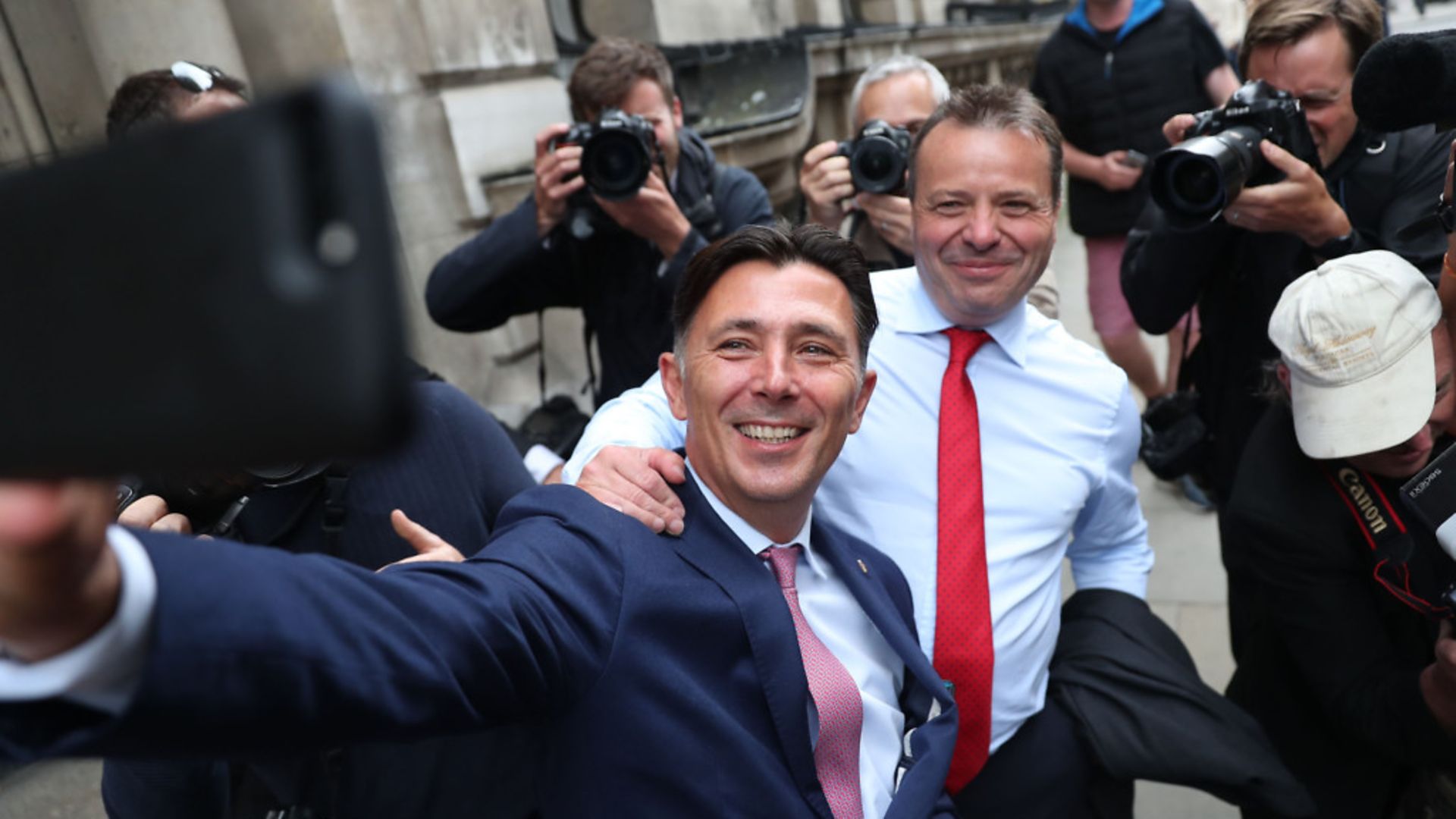 Brexit campaign donor and businessman Arron Banks (right) with Leave.EU campaigner Andy Wigmore in 2018. - Credit: AFP via Getty Images