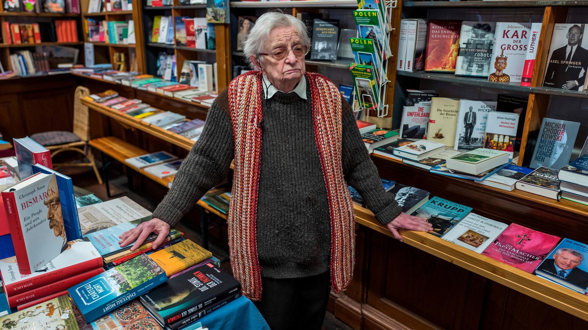 Helga Weyhe in her shop in Salzwedel in 2018. When Weyhe began work at the shop, the Red Army was on the march toward the town, Hitler still clung to power and Sartre had just published No Exit - Credit: JOHN MACDOUGALL/AFP via Getty Images