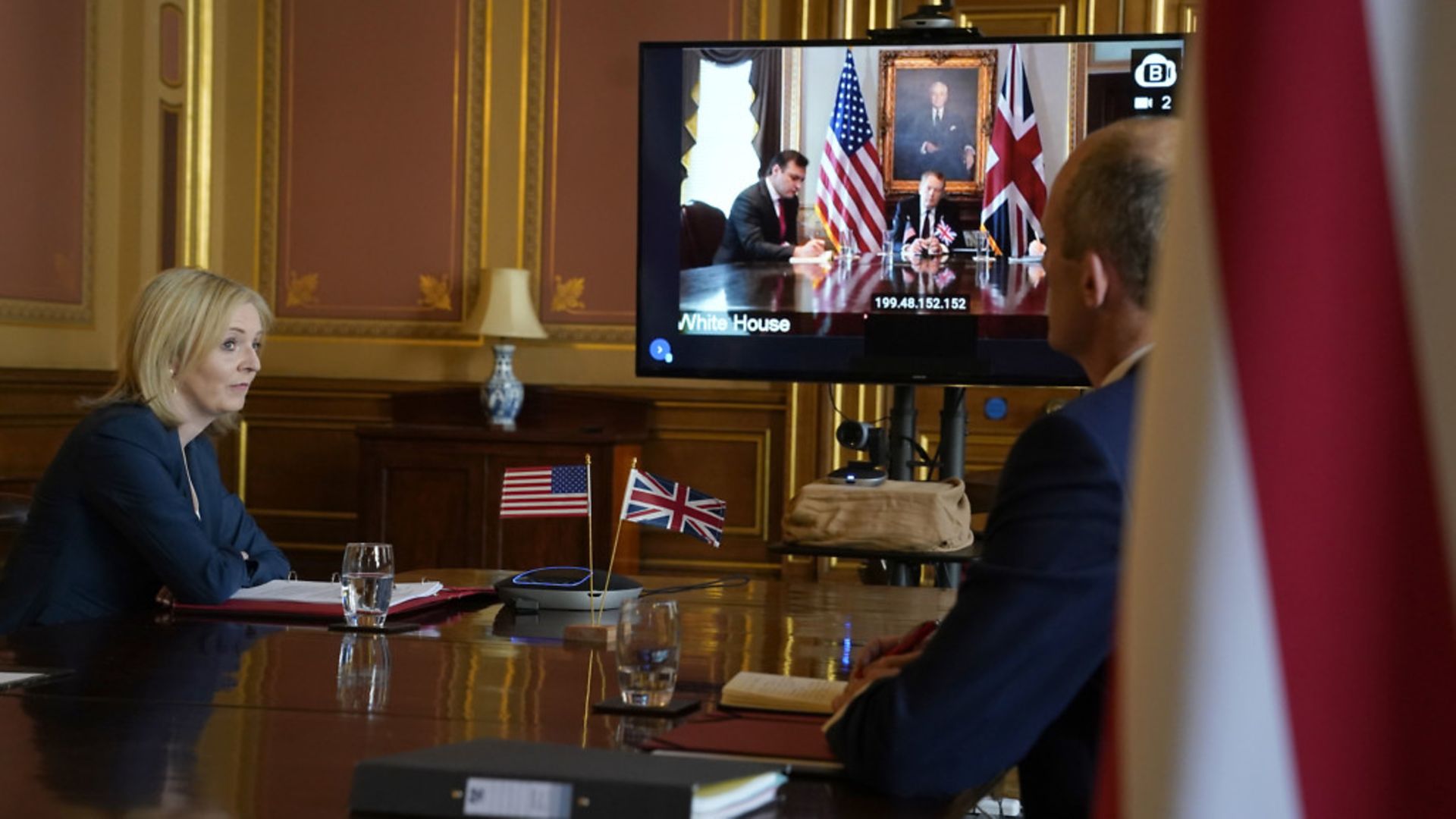 International Trade Secretary Liz Truss and the US trade representative Robert Lighthizer (on screen) as they formally begin the UK-US trade talks during a video conference call - Credit: Andrew Parsons/10 Downing Street/Crown Copyright/PA Wire