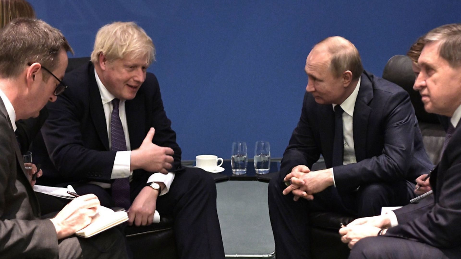 British Prime Minister Boris Johnson, centre left, and Russian President Vladimir Putin, second right, meet in Germany. (Alexei Nikolsky, Sputnik, Kremlin Pool Photo via AP) - Credit: AP