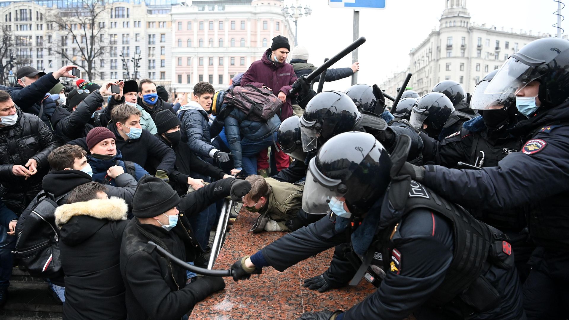 Protesters clash with riot police during a rally in support of jailed opposition leader Alexei Navalny in downtown Moscow - Credit: AFP via Getty Images