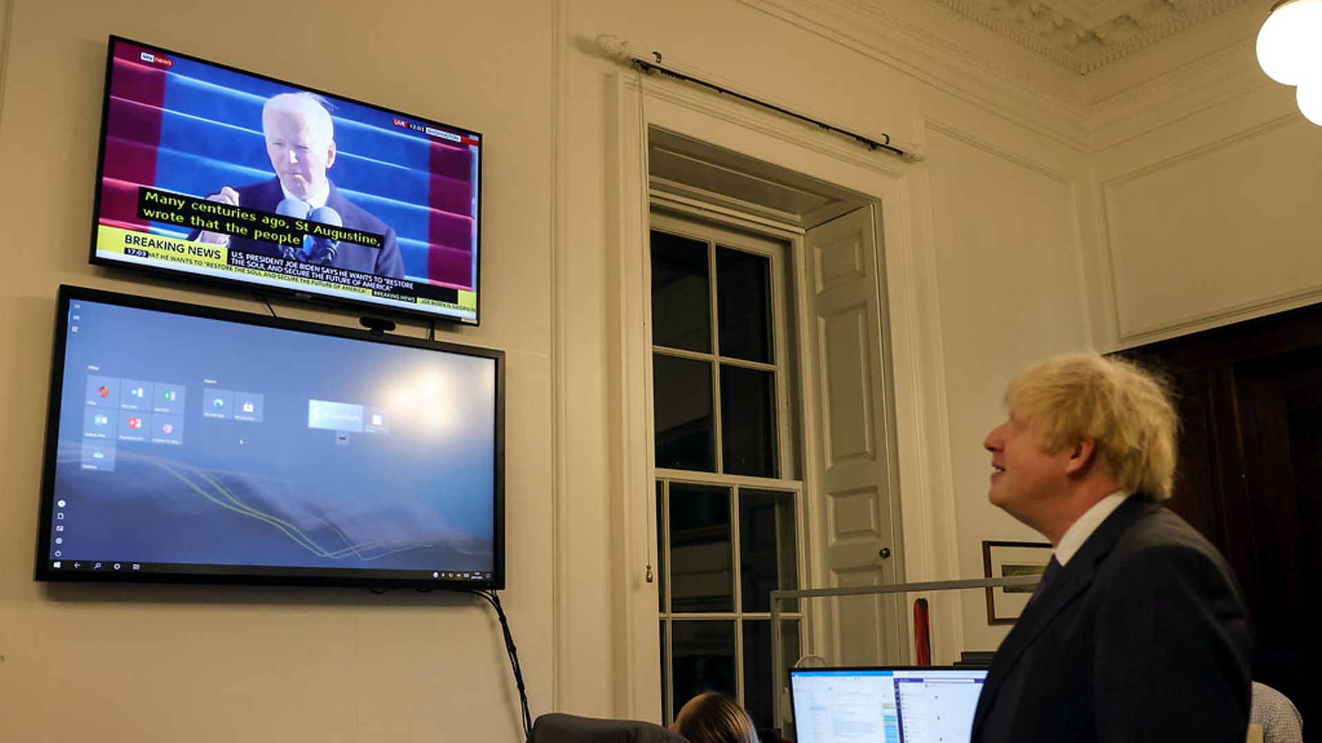 Boris Johnson watches Joe Biden's inauguration speech - Credit: Pippa Fowles / No10 Downing Stre