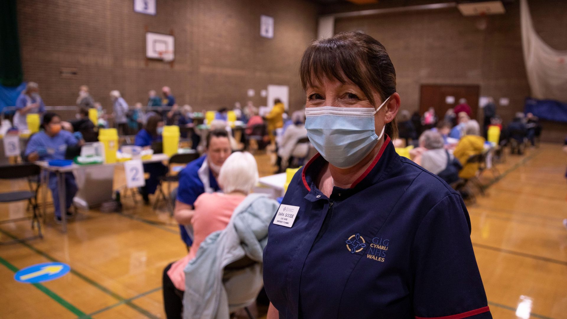 Sarah Jane Goode, a nurse at Aneurin Bevan University Health Board Trust, at a vaccine hub in Newbridge, Wales - Credit: Getty Images