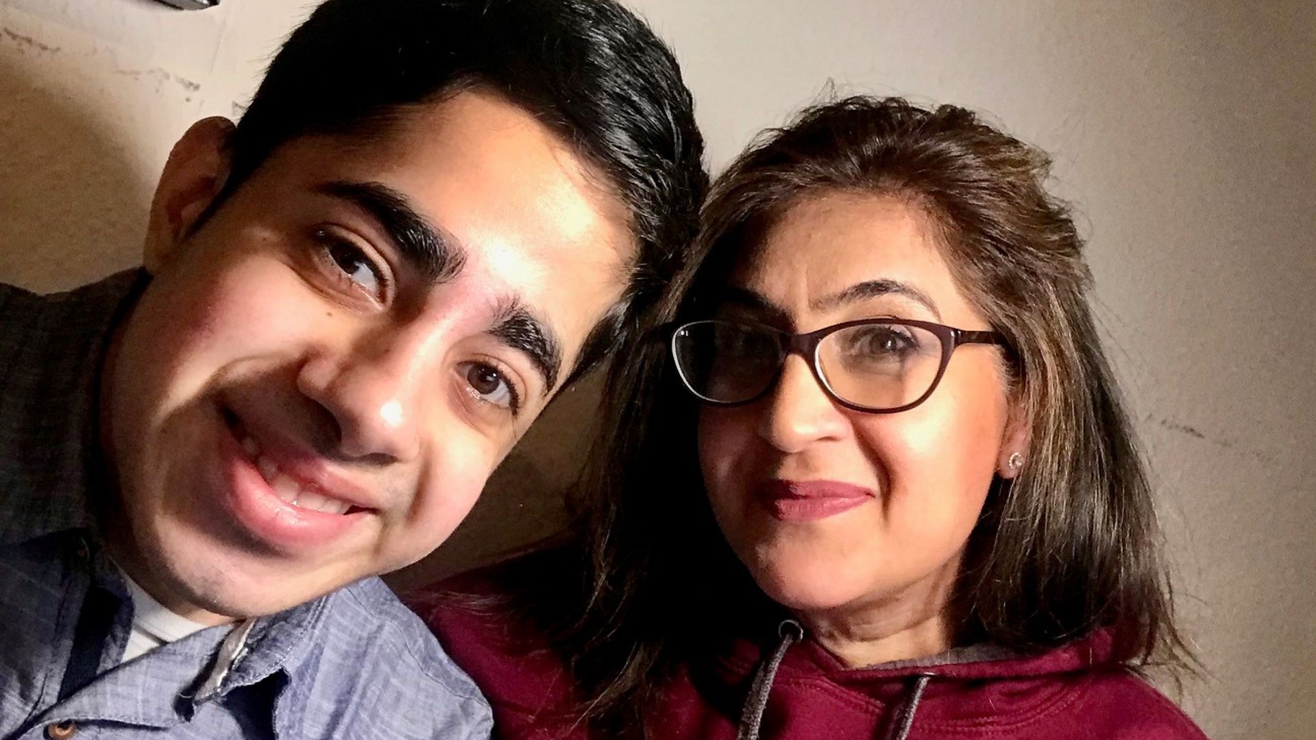 Faizan Sheikh with his mother. The student, who has a severe stammer, has described US President Joe Biden as an "inspiration" for opening up about his own speech condition. - Credit: PA