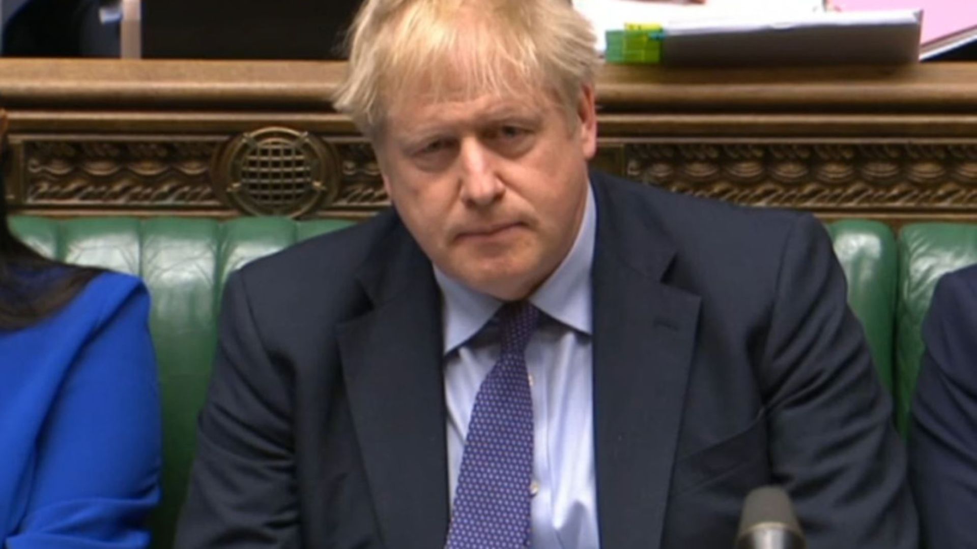 Prime Minister Boris Johnson listens in the House of Commons - Credit: PA