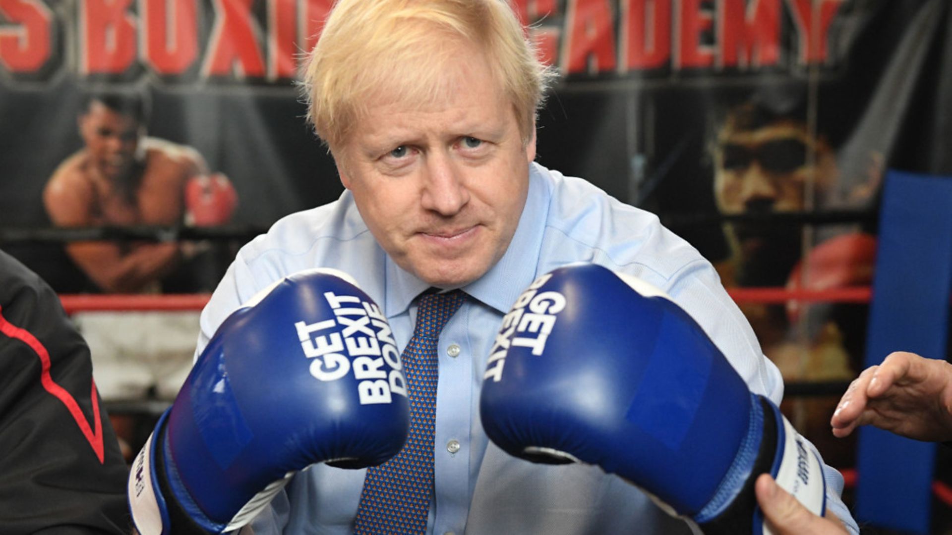 Boris Johnson in 'get Brexit done' gloves - Credit: PA