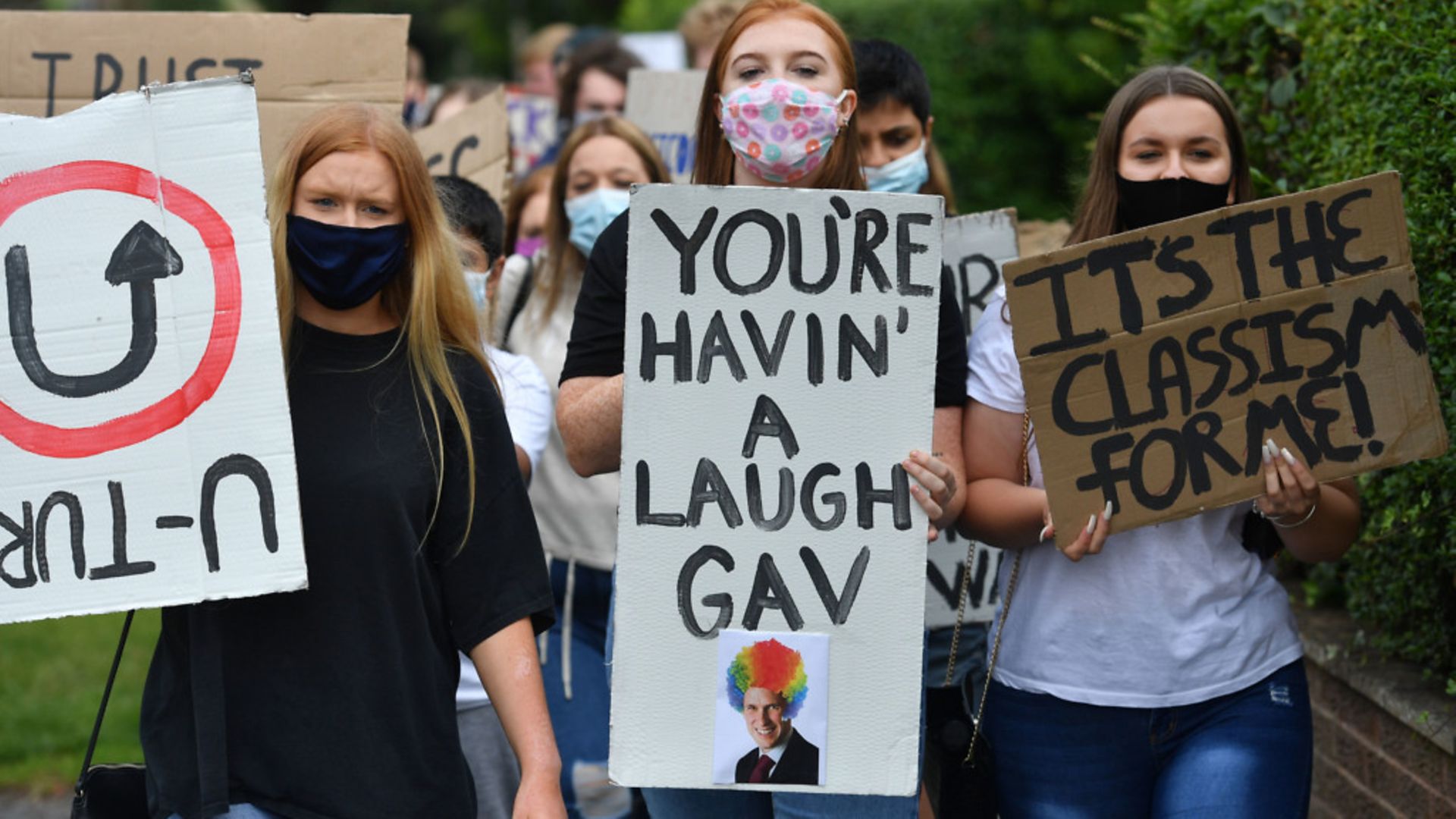 Students from Codsall Community High School march to the constituency office of their local MP Gavin Williamson, who is also the education secretary - Credit: PA