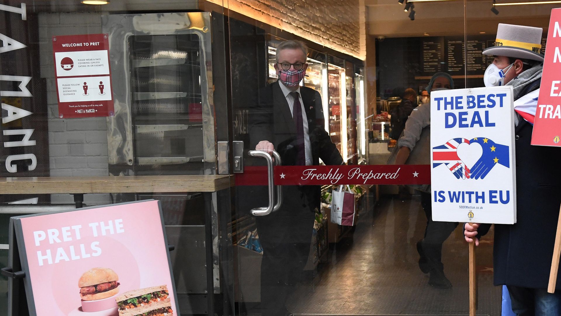 The Chancellor of the Duchy of Lancaster, Michael Gove, collects his morning coffee from a coffee shop in central London - Credit: PA