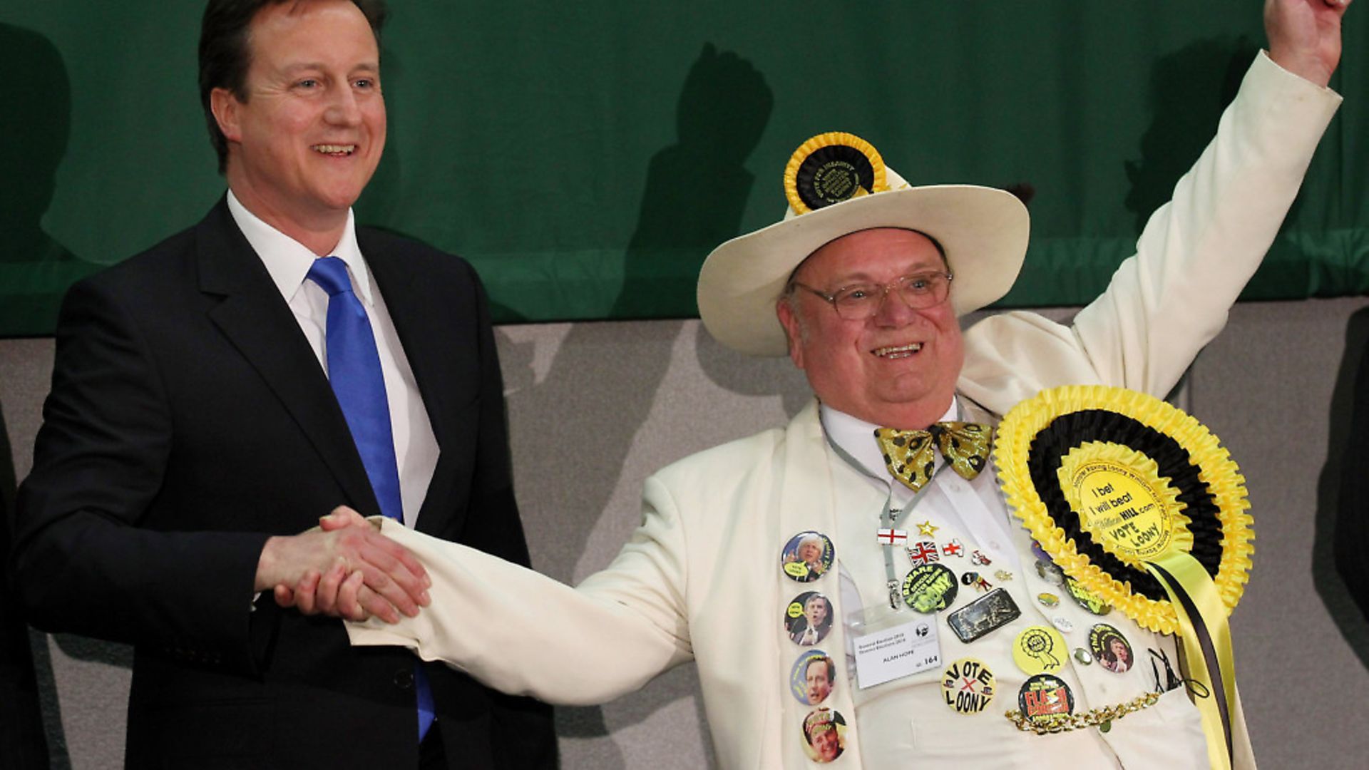 The then Conservative Party leader David Cameron (L) celebrates retaining his parliamentary seat with Monster Raving Loony William Hill Party candidate Alan Hope on May 7, 2010 in Witney.  (Photo by Peter Macdiarmid/Getty Images) - Credit: Getty Images
