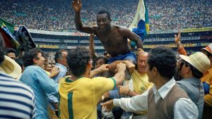 Pele is held aloft after Brazil beat Italy 4-1 to win the World Cup final on June 21st 1970. - Credit: Getty Images