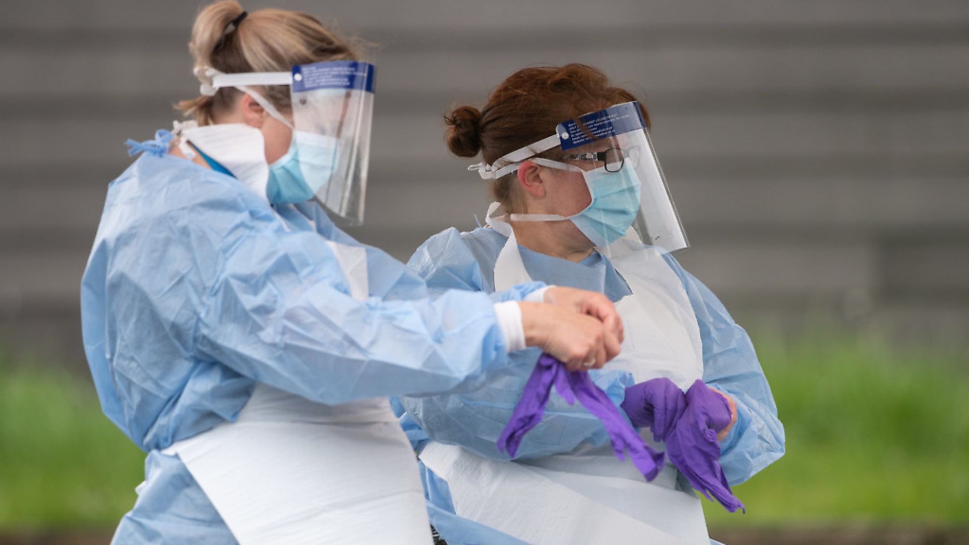 NHS workers wearing full PPE Picture: Joe Giddens/PA - Credit: PA