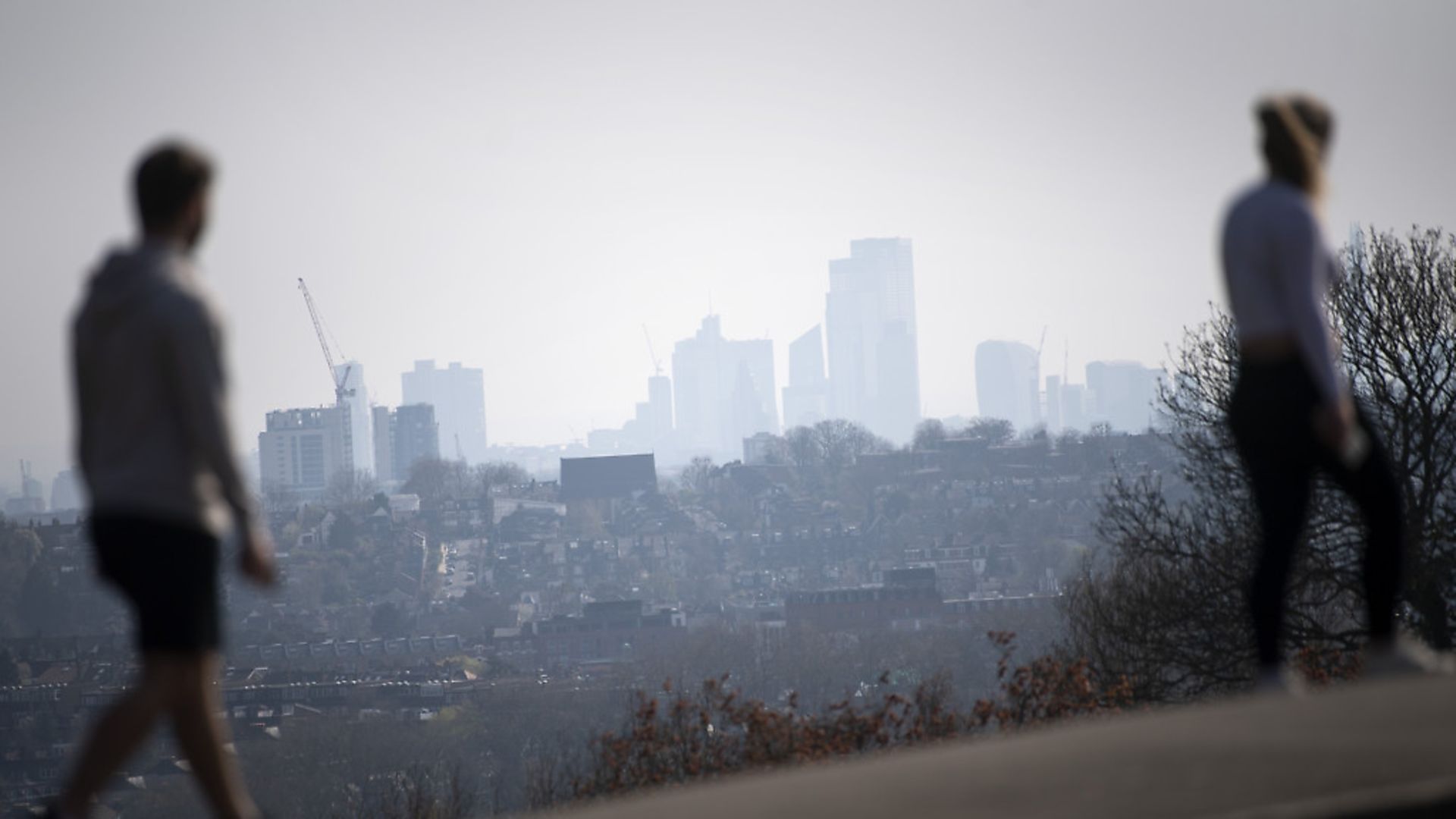Two walkers observing social distancing in Alexandra Palace, North London as the UK continues in lockdown to help curb the spread of the virus. Picture: PA/Victoria Jones - Credit: PA