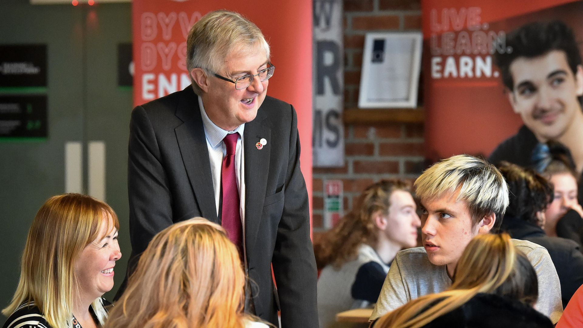 Wales' first minister Mark Drakeford chats with students at the ACT Training Centre - Credit: PA