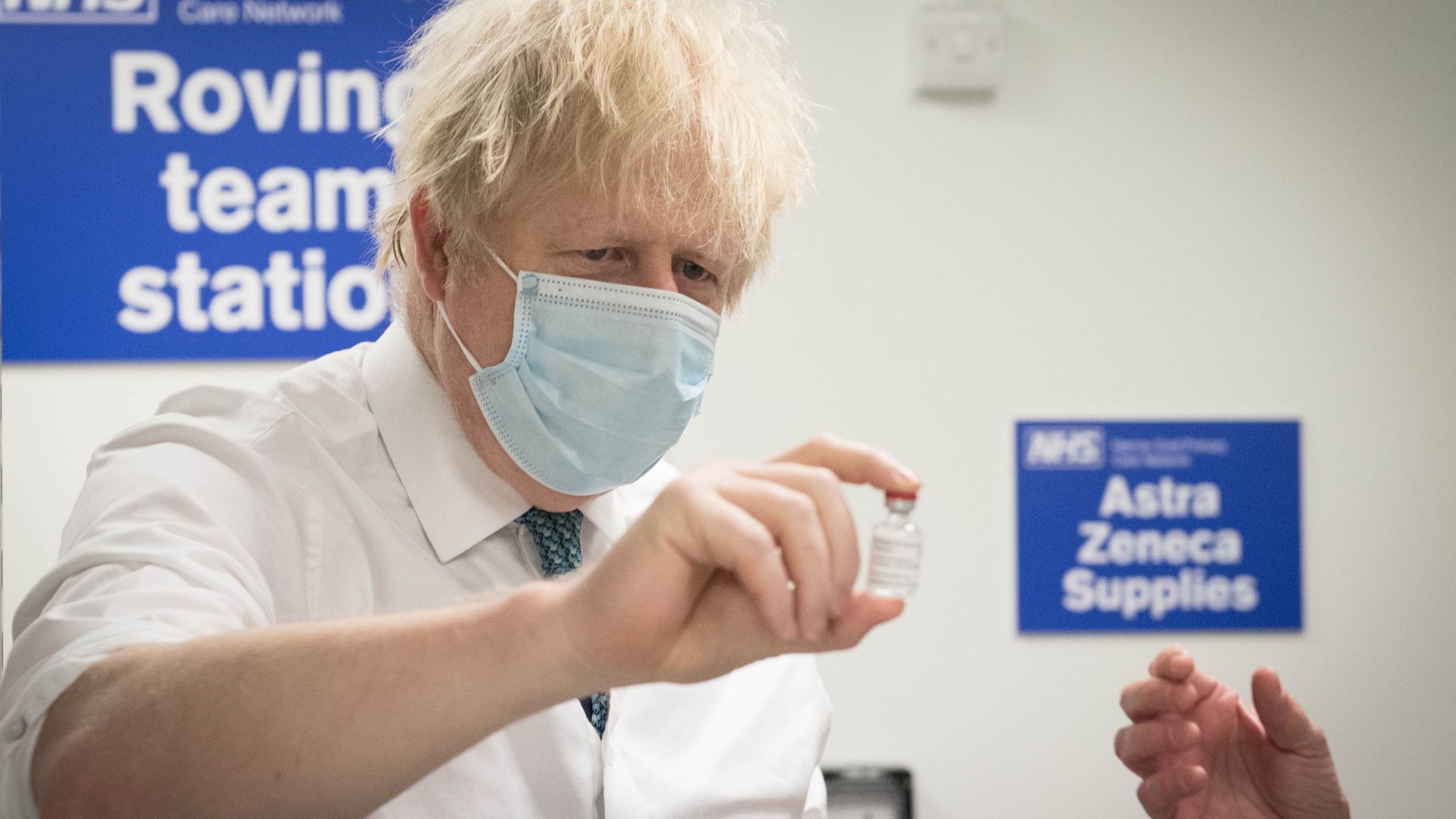 Prime minister Boris Johnson sees how a dose of the Oxford/Astra Zeneca Covid 19 vaccine is prepared - Credit: PA