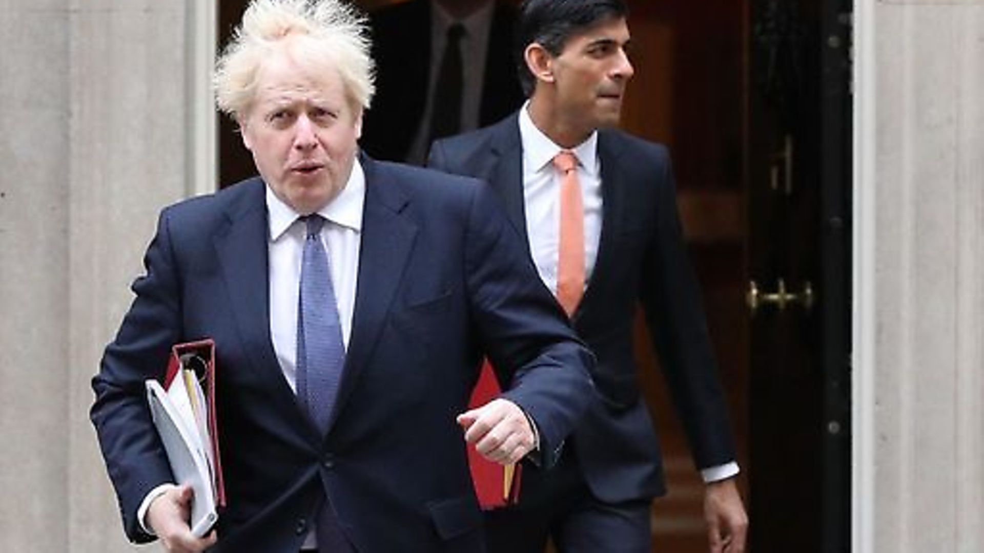 Prime Minister Boris Johnson (left) and Chancellor of the Exchequer Rishi Sunak leave 10 Downing Street London, ahead of a Cabinet meeting at the Foreign and Commonwealth Office. - Credit: PA