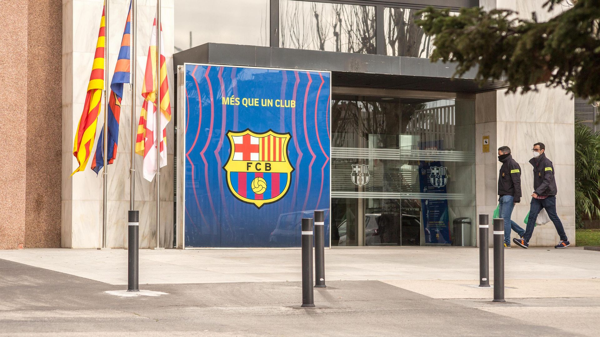 Police officers are seen entering FC Barcelona's office on March 1, 2021 as part of an ongoing investigation into alleged corruption that led to the arrest of former club president Josep Mari­a Bartomeu - Credit: SOPA Images/LightRocket via Gett