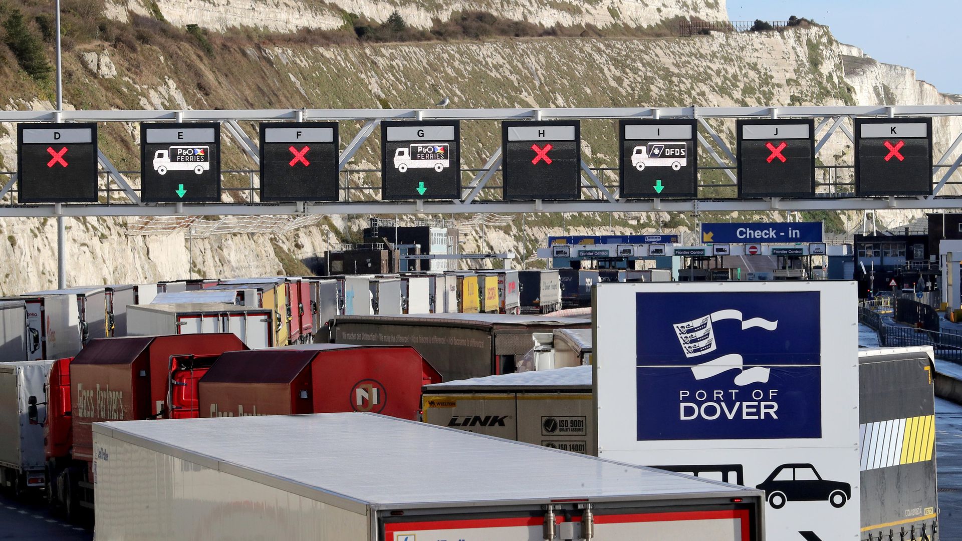 Lorries queue for the frontier control area at the Port of Dover in Kent - Credit: PA