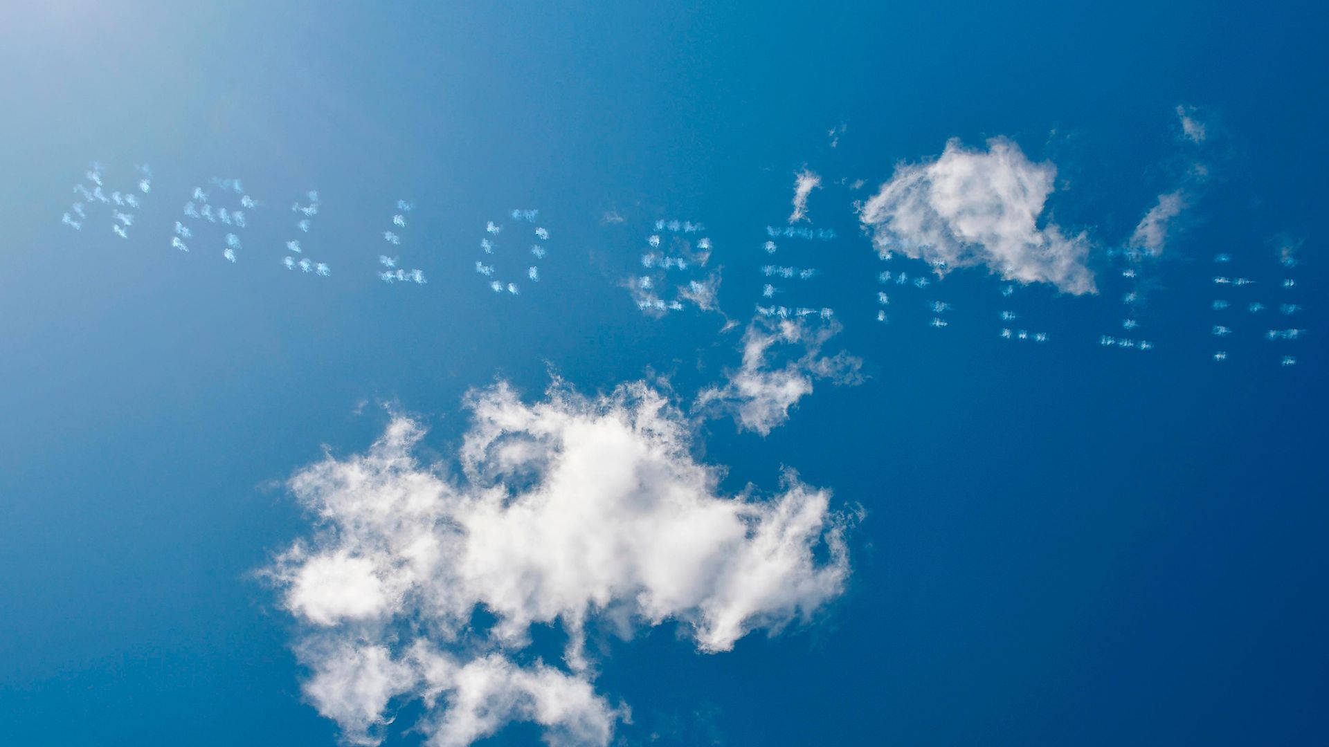 Aeroplanes write Hello Berlin in the sky in Berlin's former Tempelhof airport on March 5, 2021 - Credit: AFP via Getty Images