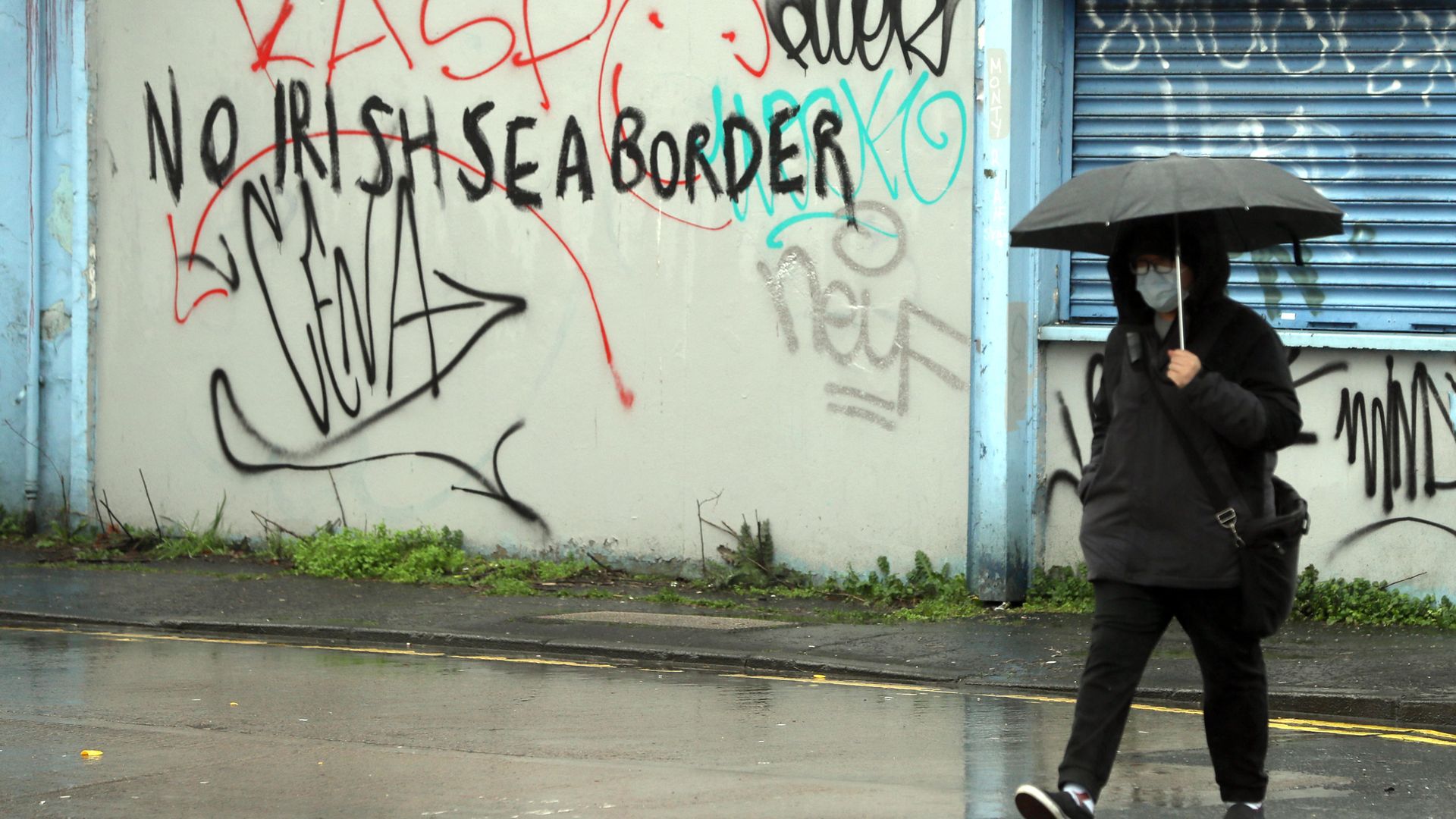 Graffiti reading 'No Irish Sea border' Stroud Street in Belfast - Credit: PA