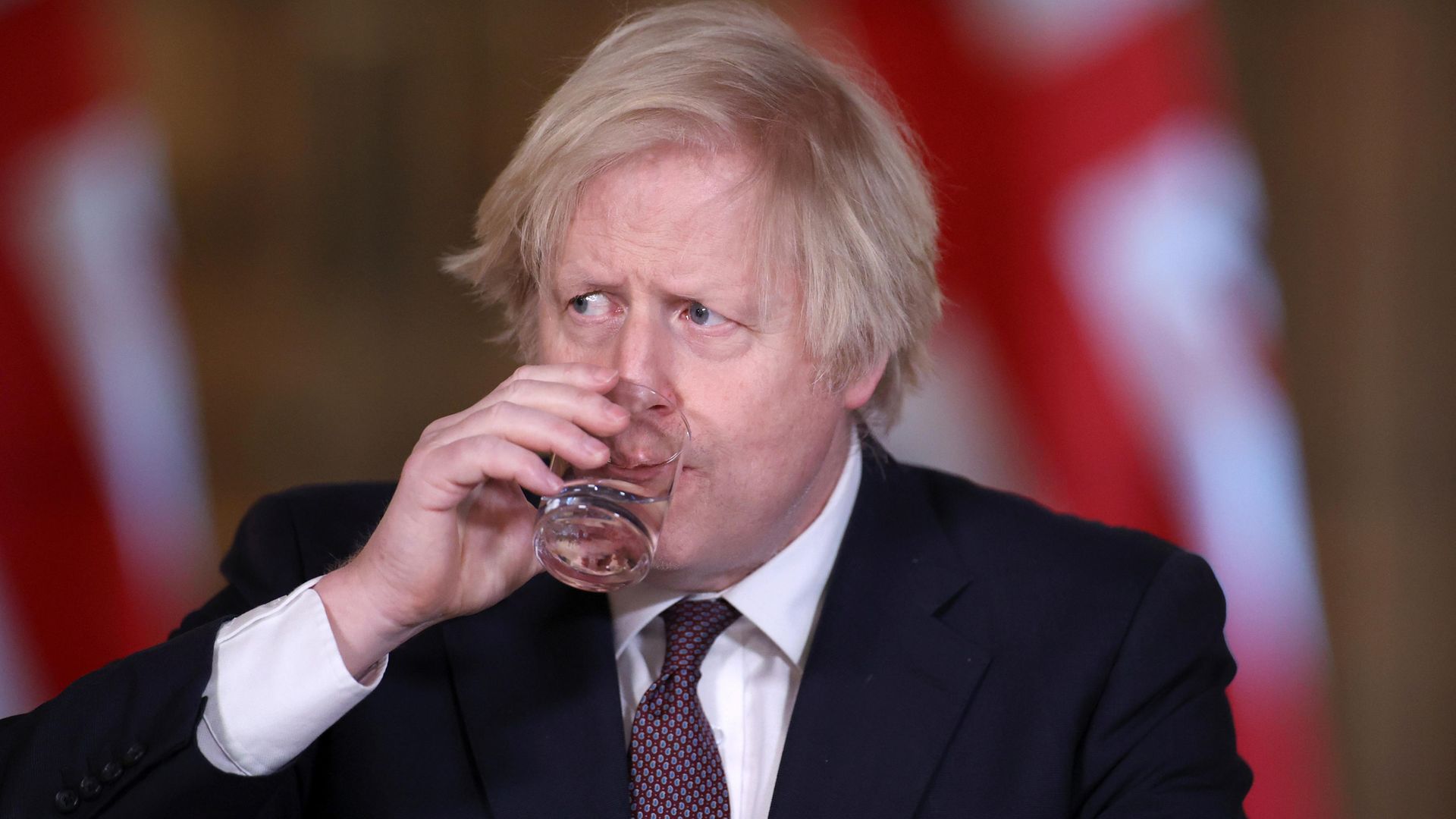 Prime minister Boris Johnson drinks a glass of water during a media briefing in Downing Street, London, on coronavirus (COVID-19) - Credit: PA