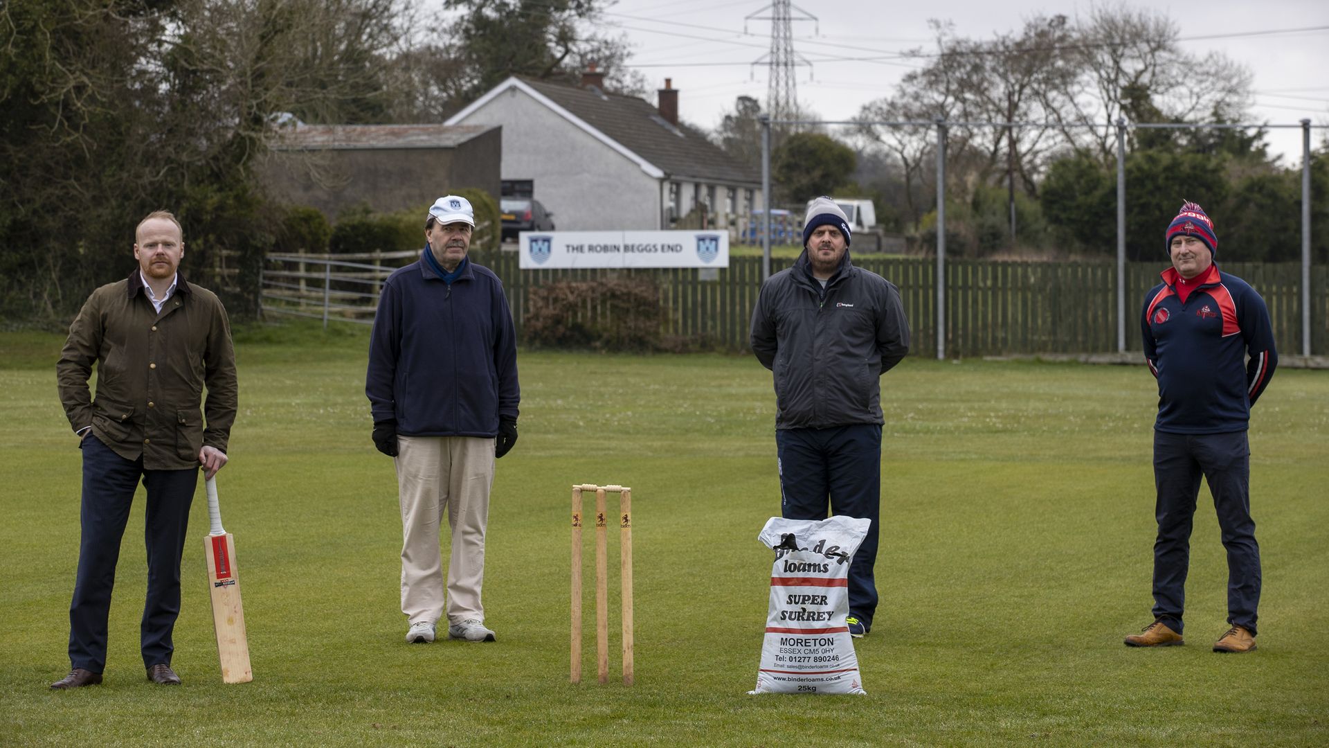 (left to right) UUP MLA John Stewart, President of the Northern Cricket Union (NCU) Roger Bell, NCU Grounds Committee Member Michael Kennedy and NCU Cricket Operations Manager Uel Graham on the crease of Carrickfergus Cricket Club. The special cricket pitch soil used for generations may have to be dug up and replaced due to the Northern Ireland Protocol, according to a groundsman. - Credit: PA