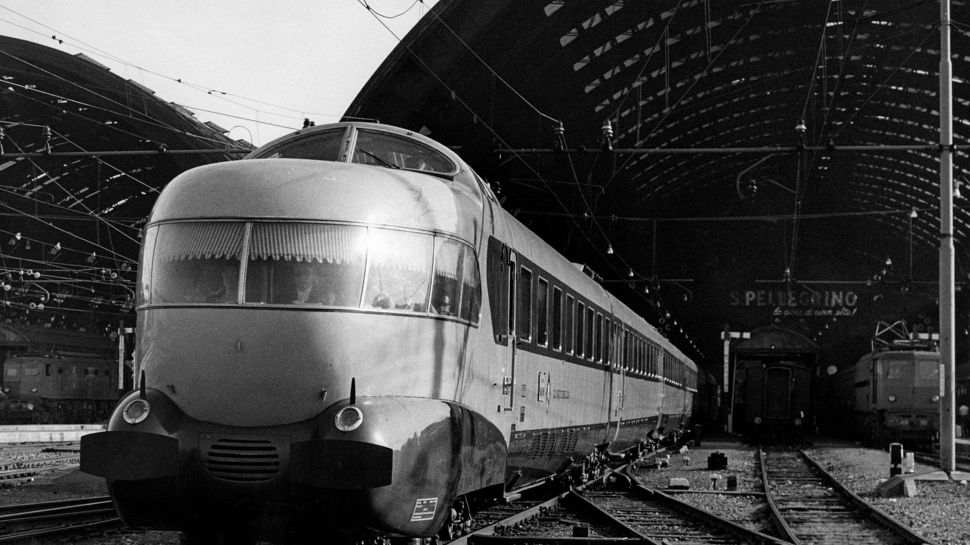 One of Italy's distinctive Settebello services – complete with observation lounge and the front – pulls out of Milan's Central Station - Credit: Touring Club Italiano/Marka/Univ