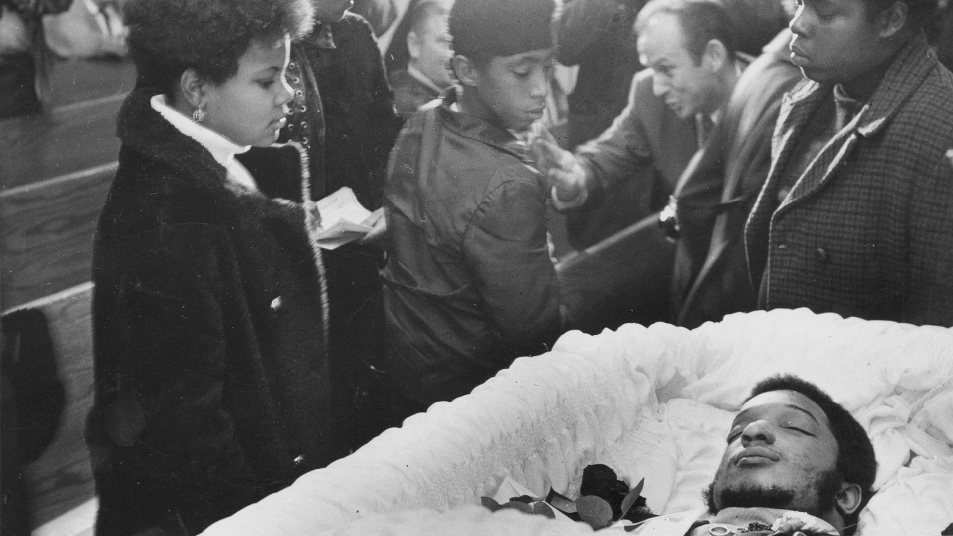 Mourners pass by the coffin of Black Panthers leader Fred Hampton at his memorial service at First Baptist Church of Melrose Park, Melrose Park, Illinois, December 9, 1969. Hampton was killed during a police raid on Dec. 4, 1969 - Credit: Ray Foster/Chicago Tribune/Tribune News Service via Getty Image