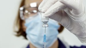 Nurse Pat Sugden prepares a vaccine at the Thackray Museum of Medicine in Leeds - Credit: PA