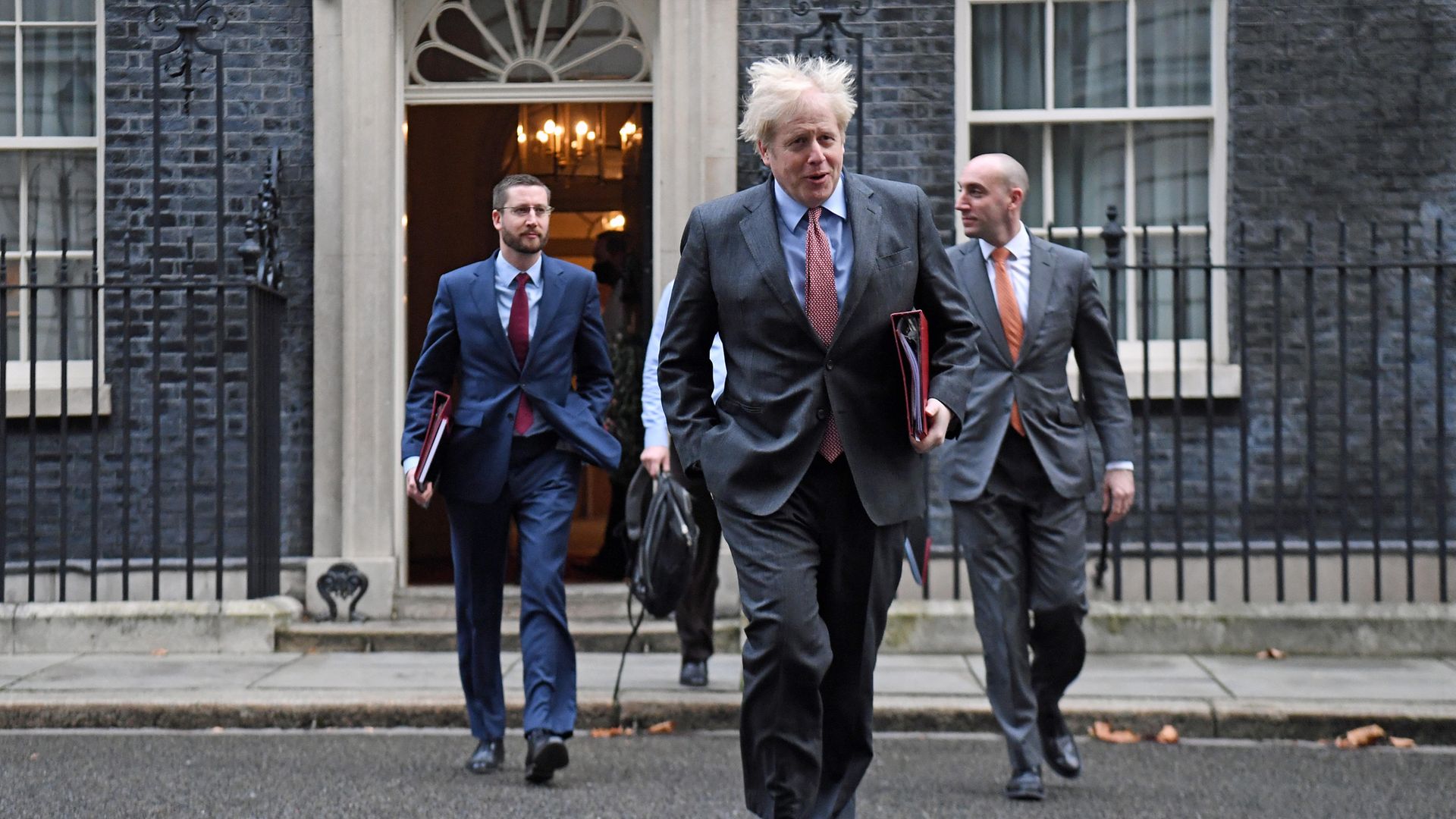 Prime Minister Boris Johnson leads colleagues including Cabinet Secretary Simon Case (left), across Downing Street as they arrive for the government's weekly Cabinet meeting at the Foreign and Commonwealth Office (FCO). - Credit: PA